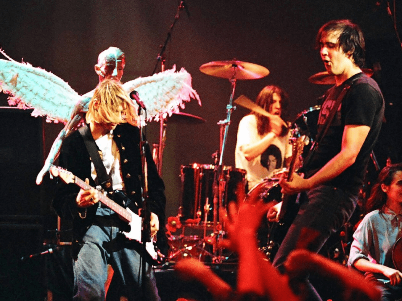 Color photo of Nirvana performing on stage.