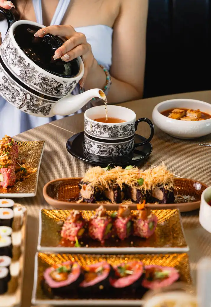 Tea served from a black and white porcelain teapot