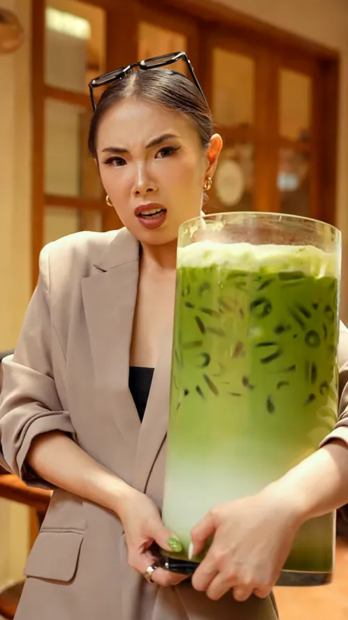 a green smoothie and a smoothie drink on a table