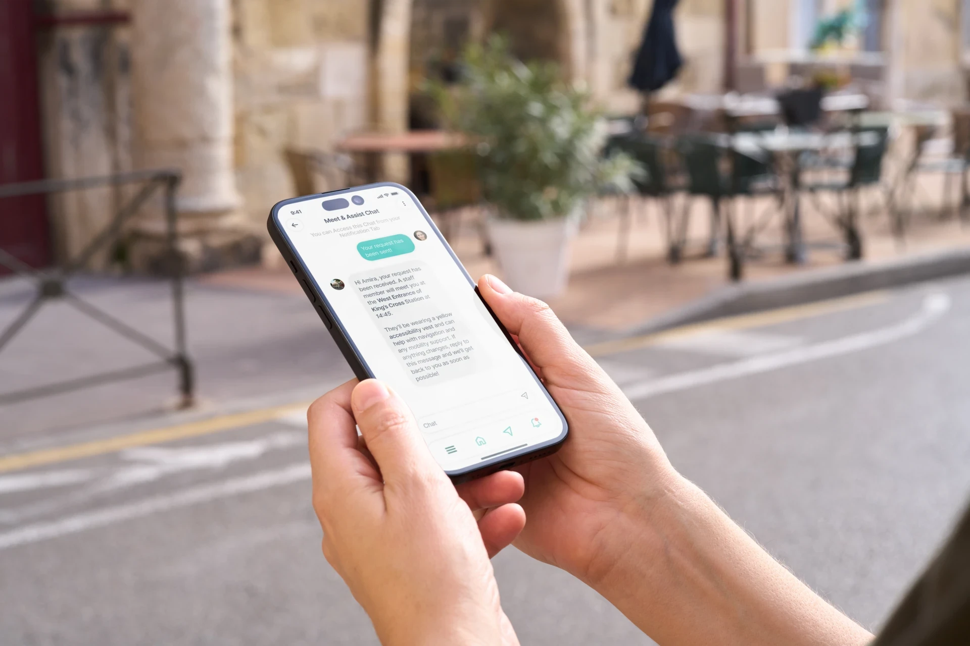 Close-up of a hand holding a phone with the Sensra interface active, showcasing app usability in context.