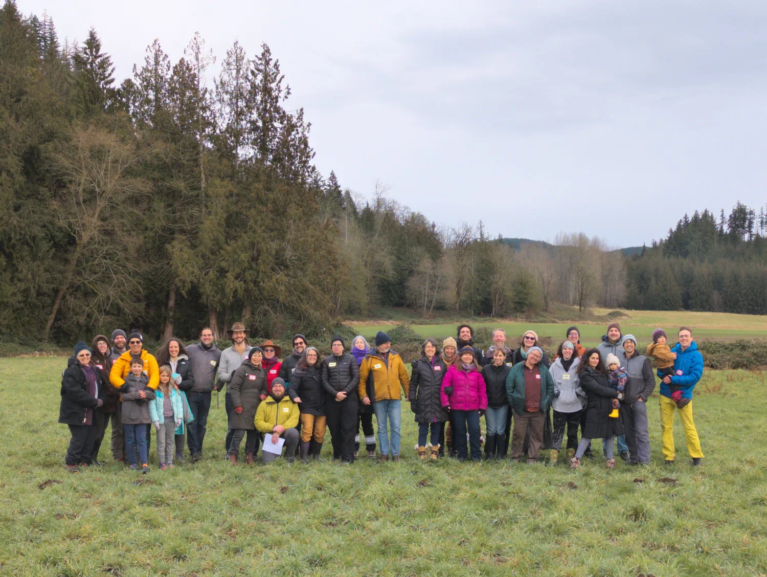 Members of the Rooted Northwest community gathered together on their rural property.