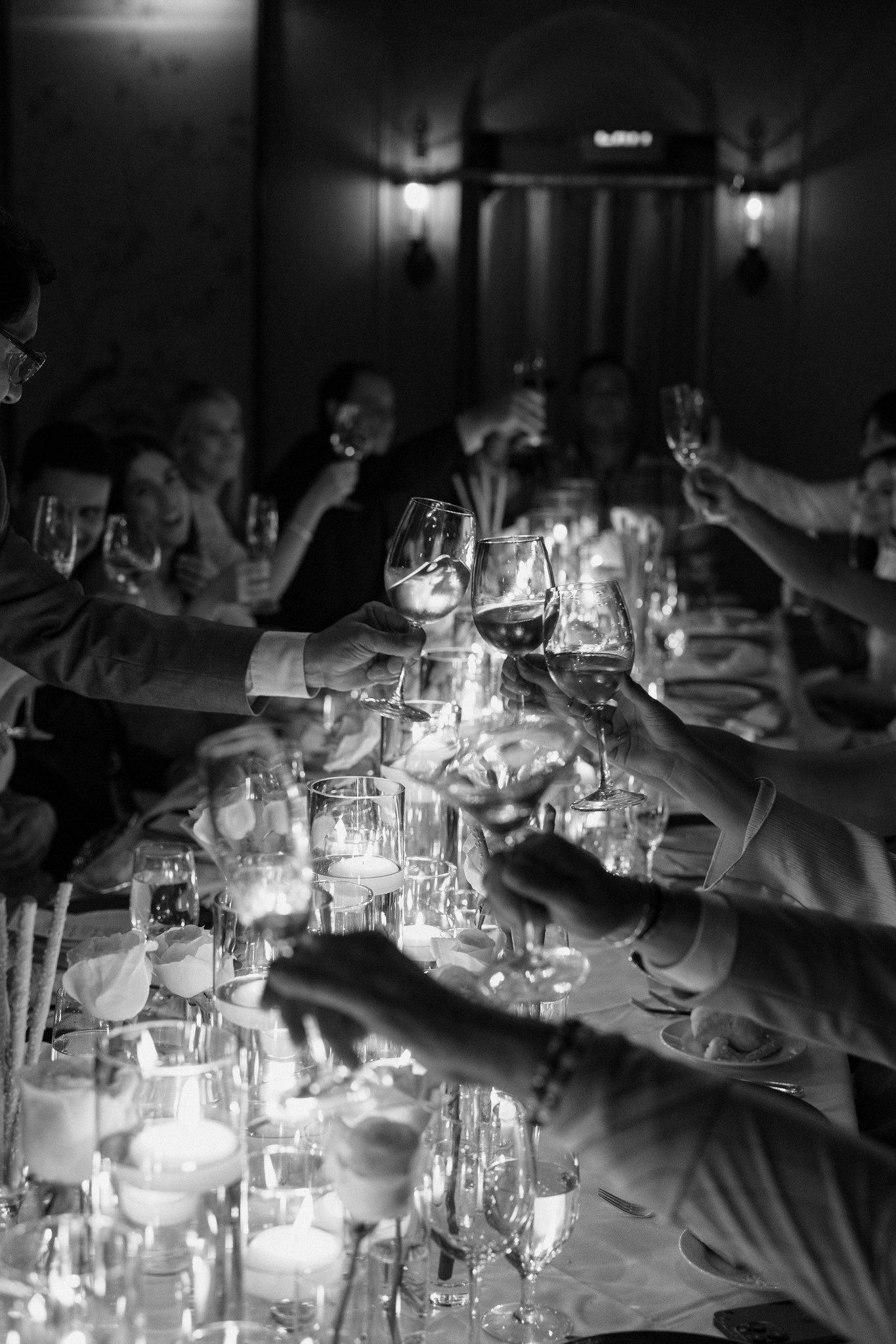     Wedding photographer in South Florida documents an intimate candlelit wedding reception in black and white film style.