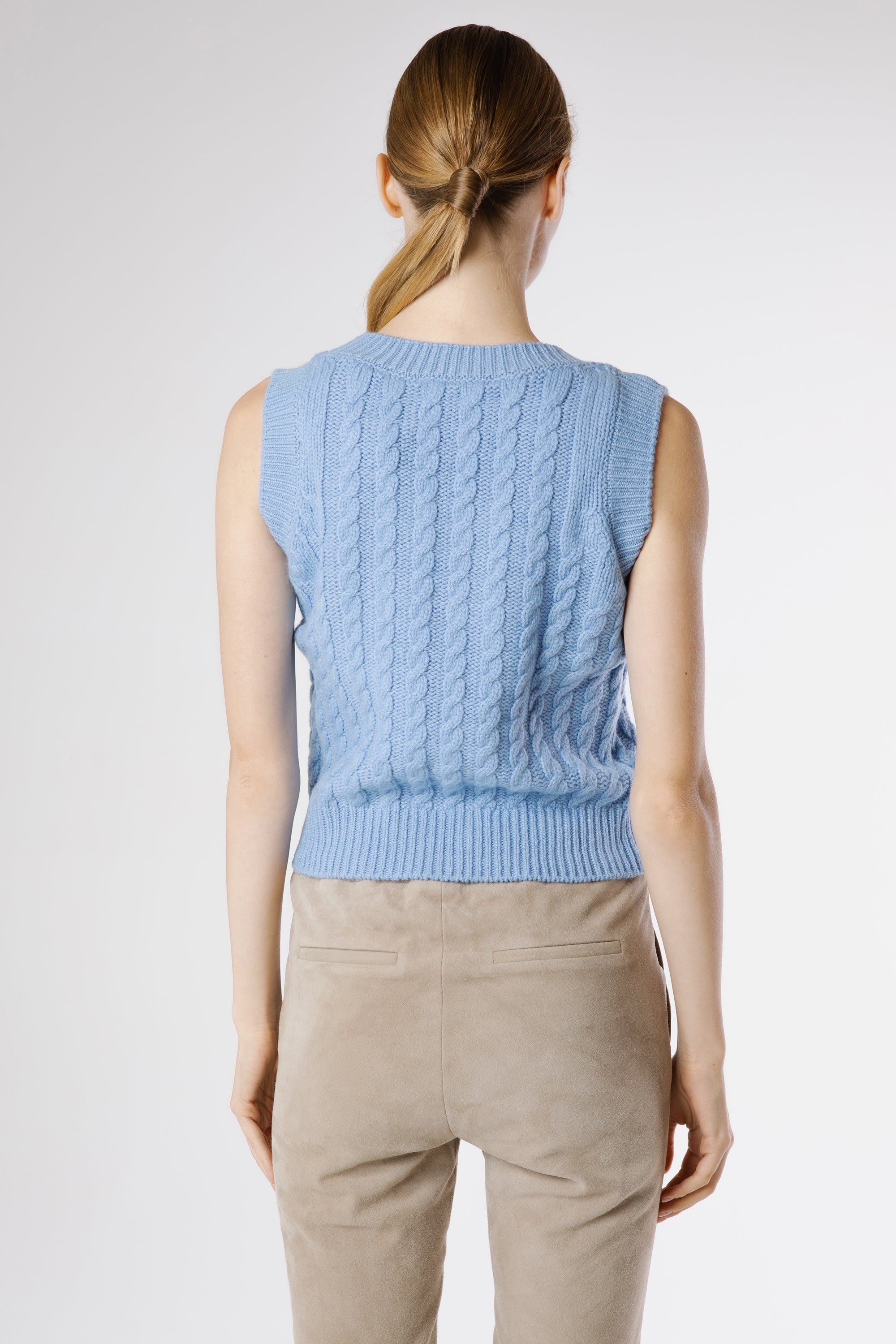Back view of Bella Cashmere Top Egyptian Blue showcasing clean sleeveless silhouette and ribbed hem.