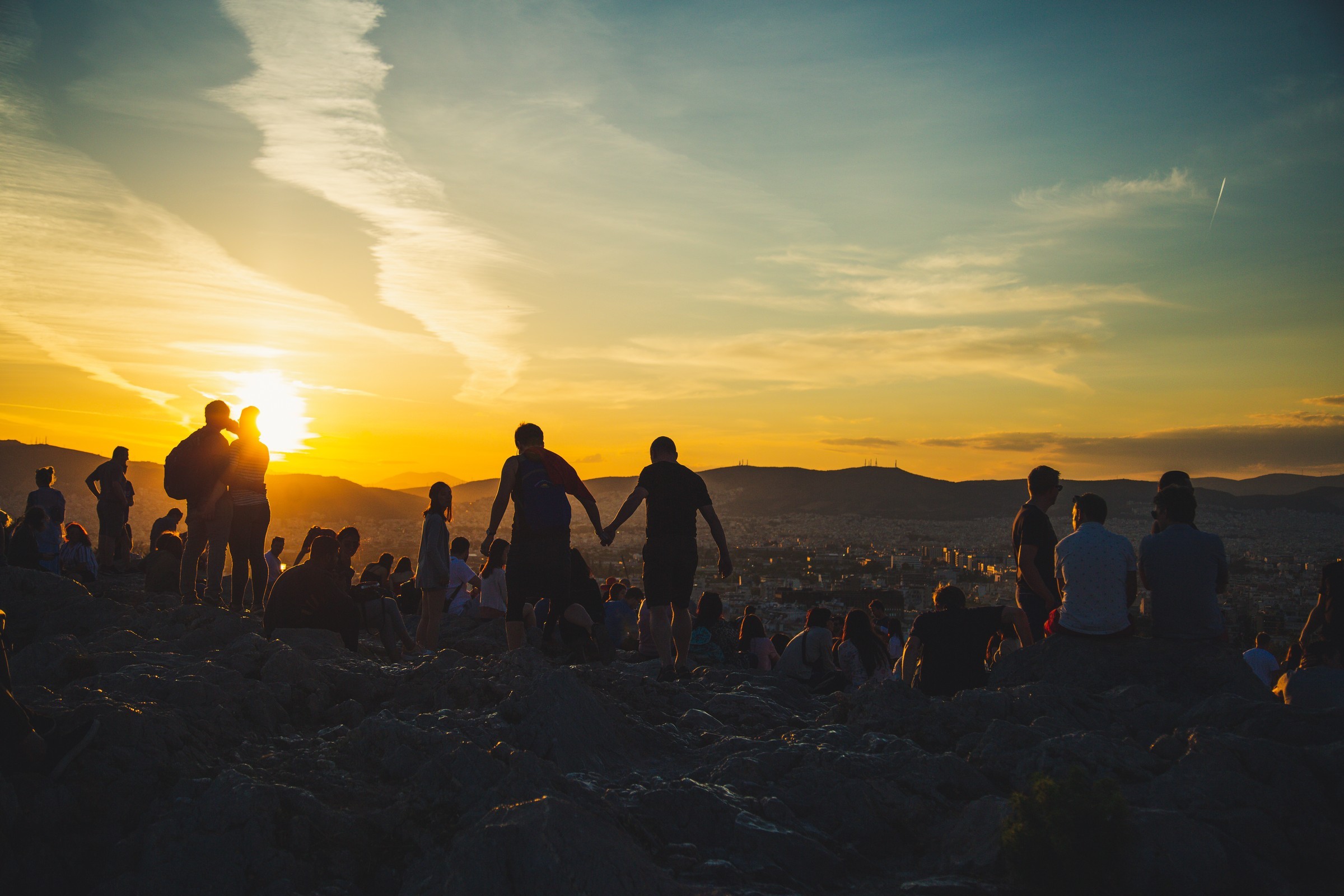 TRAVEL — People gathering at sunset.