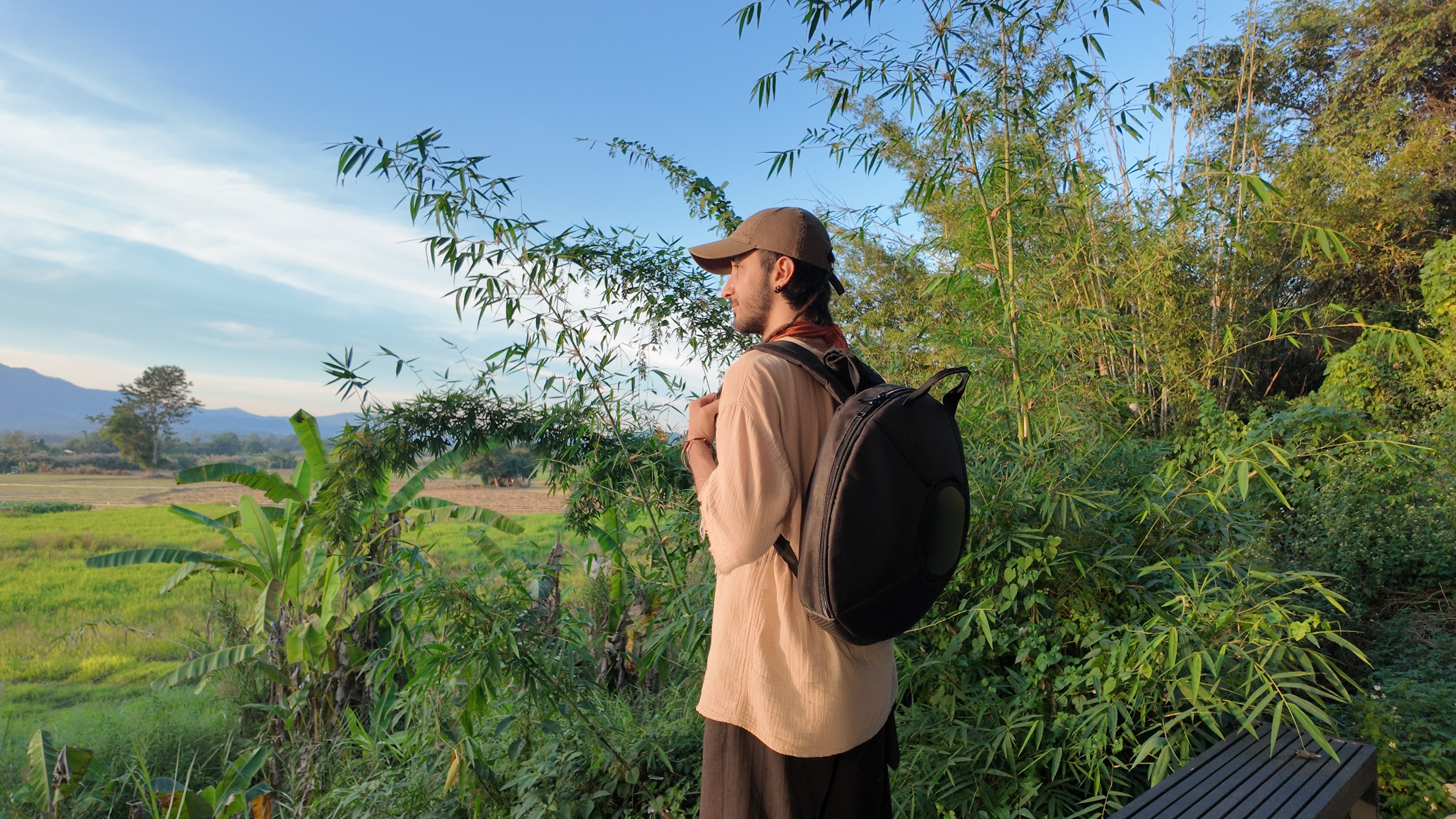 One carries a lightweight travel-sized handpan bag on his back.