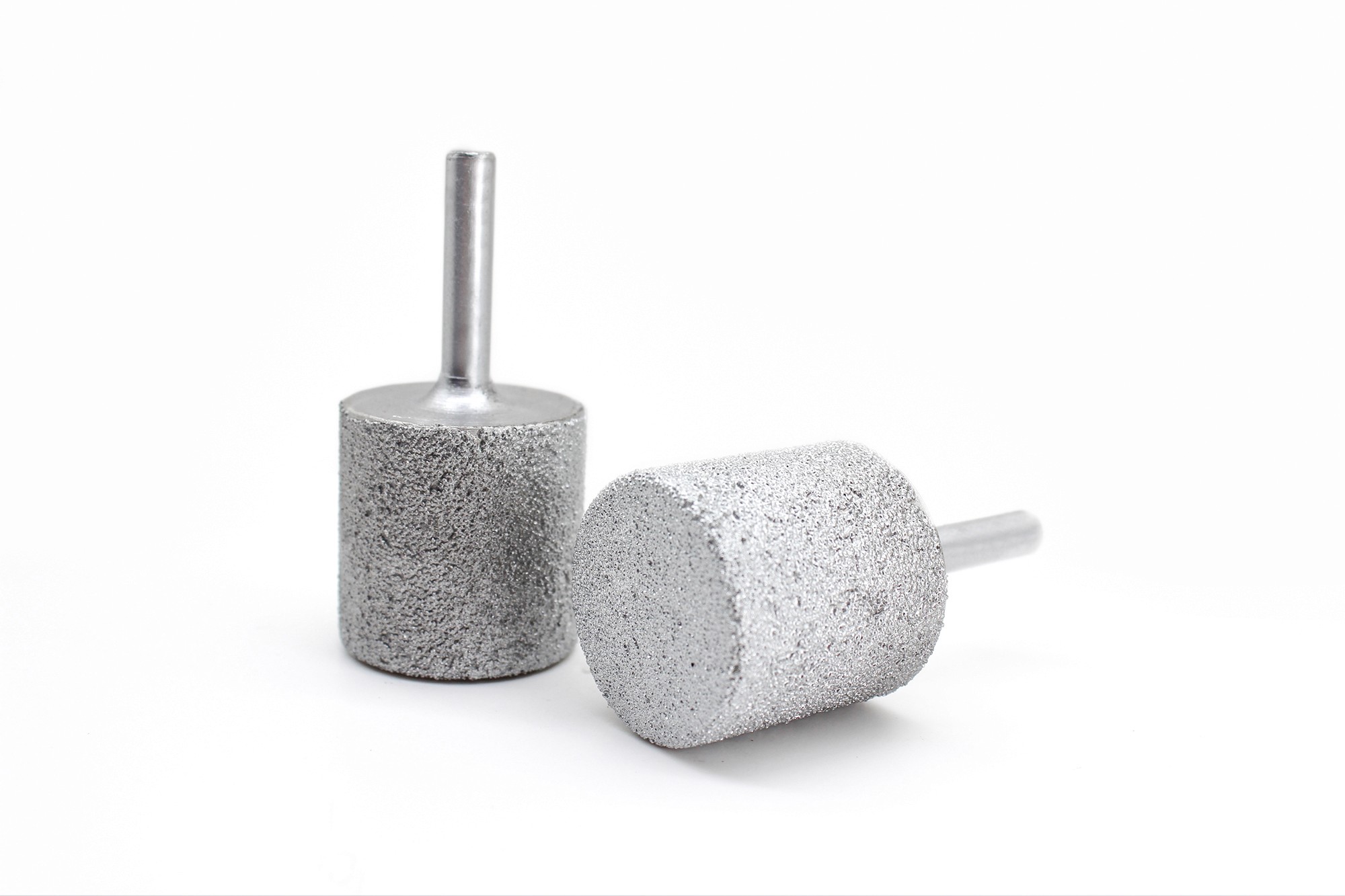 Two cylindrical Diamond Carving Bits positioned together, ideal for creating deep, straight cuts in hard stone materials.