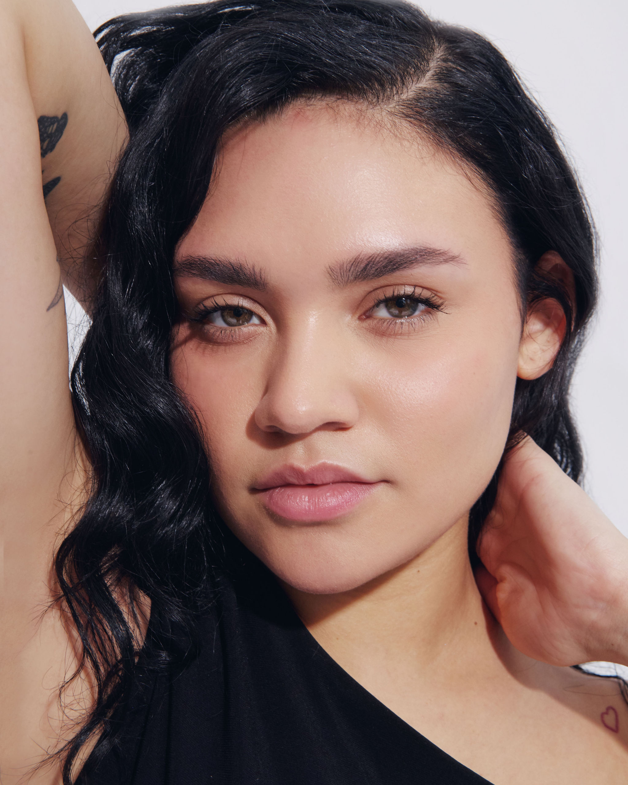 Sunlight streams through an arched window onto a ledge.