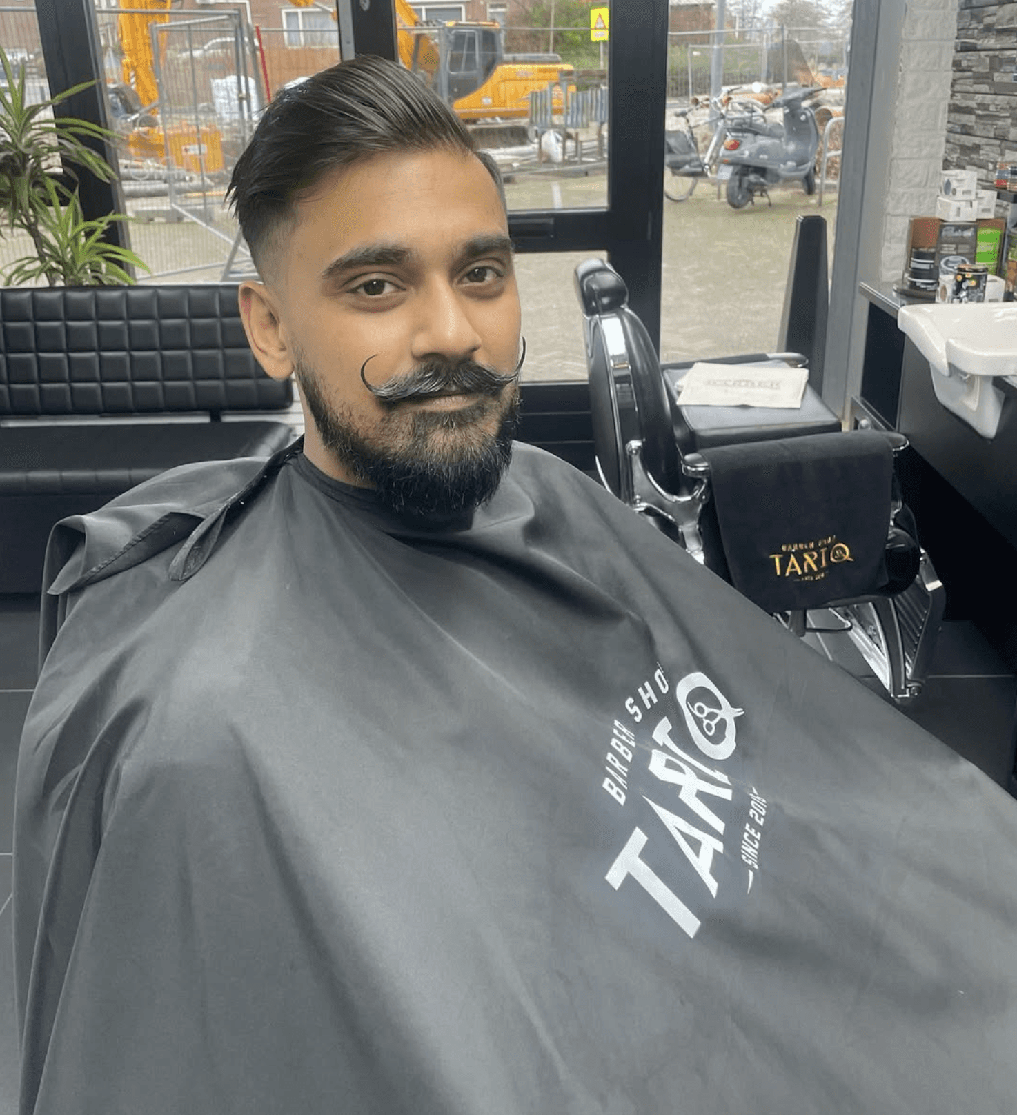 Barber attending client