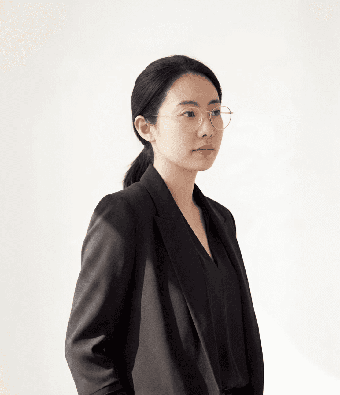 a woman sitting on a table in front of a window