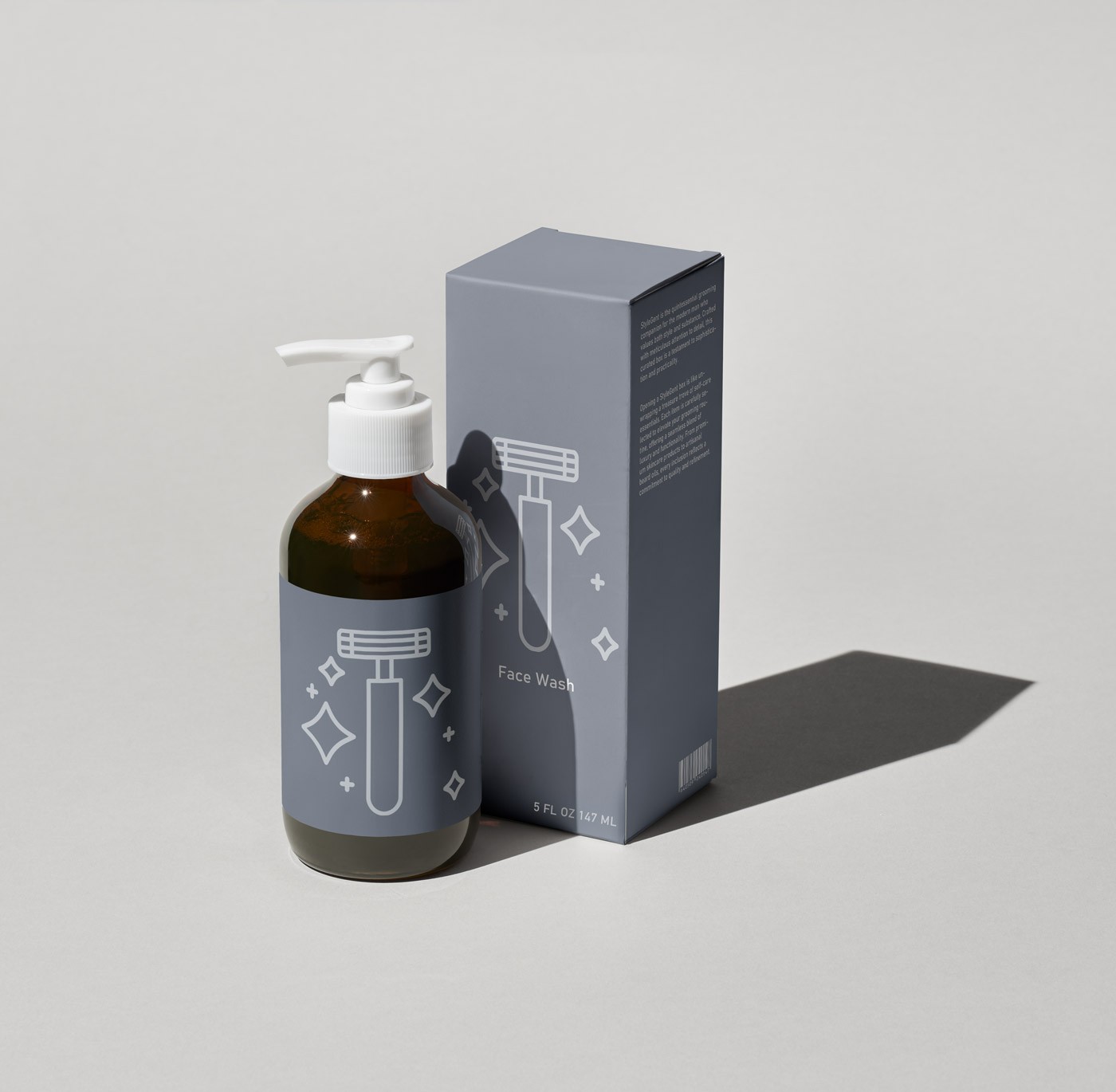 A fluffy gray rabbit rests on a floral chair.