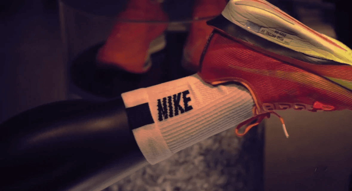Close-up of a runner’s Nike sock and sneaker during a performance shoot.
