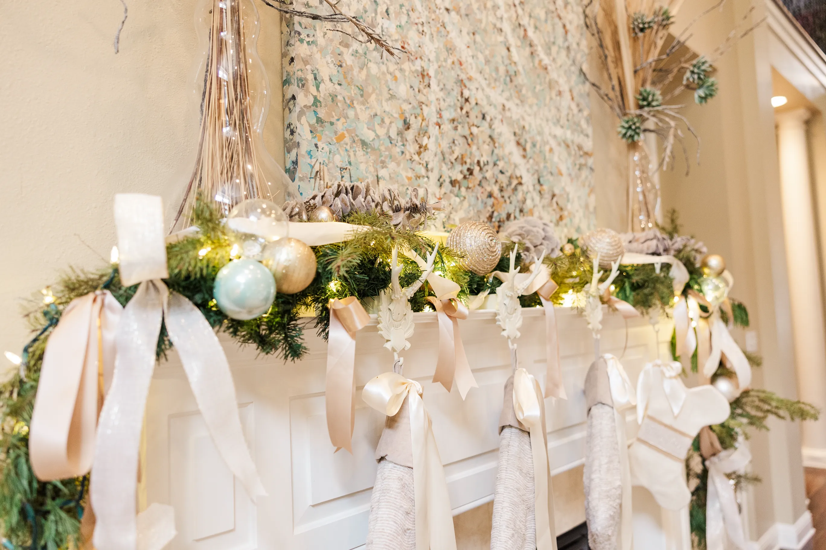 Luxury table setting by Sarah Overall Events with pink embroidered napkins, gold-rimmed plates, floral arrangements, and personalized menus in Shreveport.