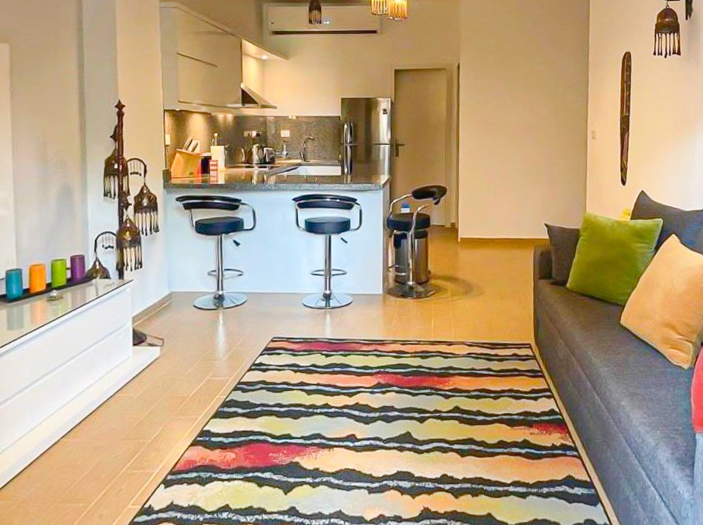 brown wooden house with green grass field