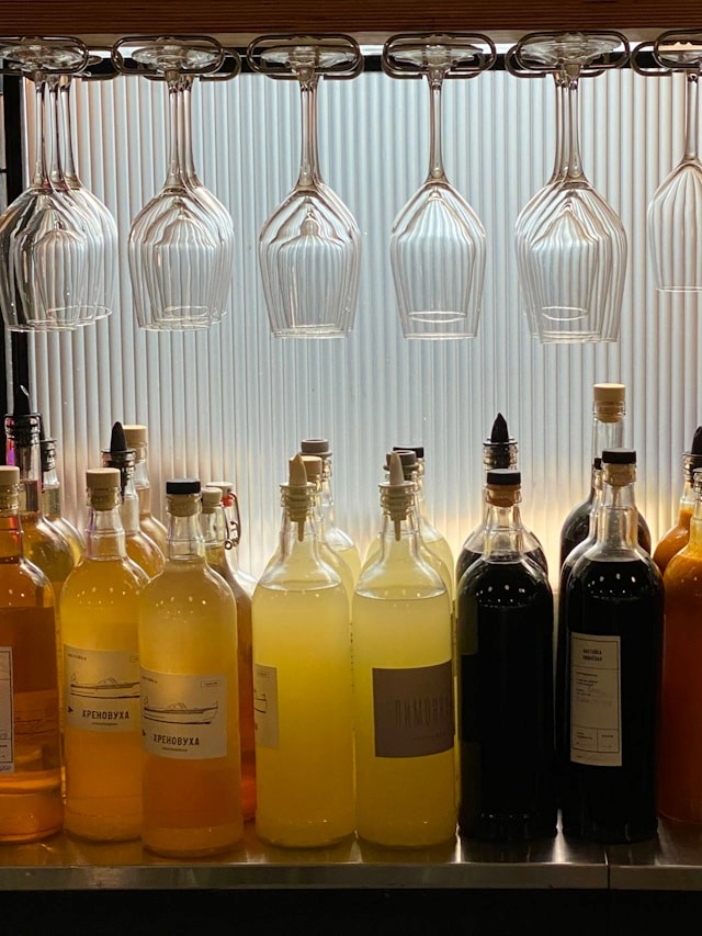Organized bar fridge with hanging chilled wine glasses