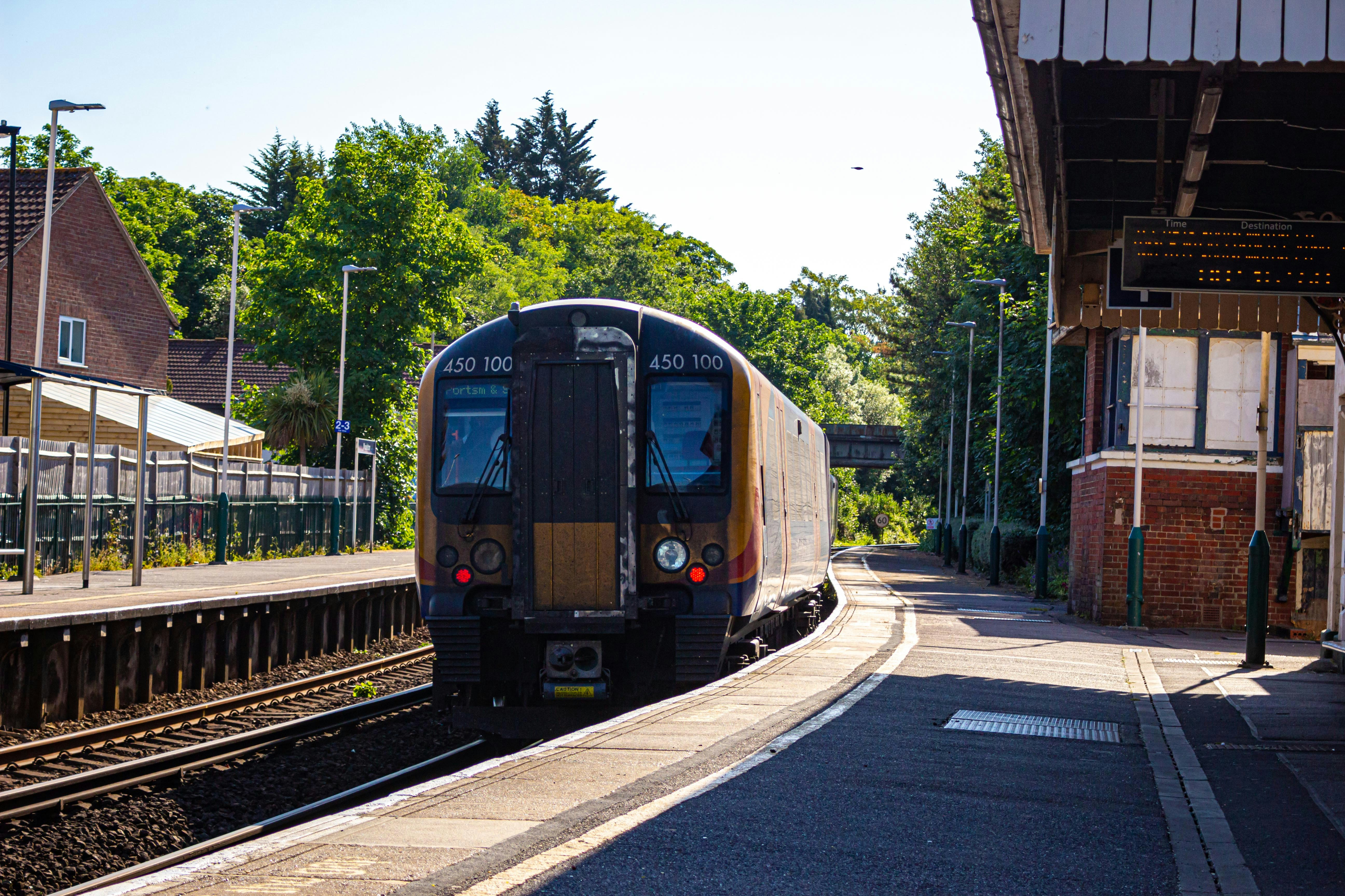 A train station with a train at the platform.