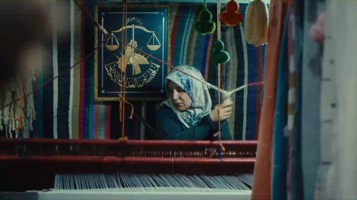 A woman sewing cloths