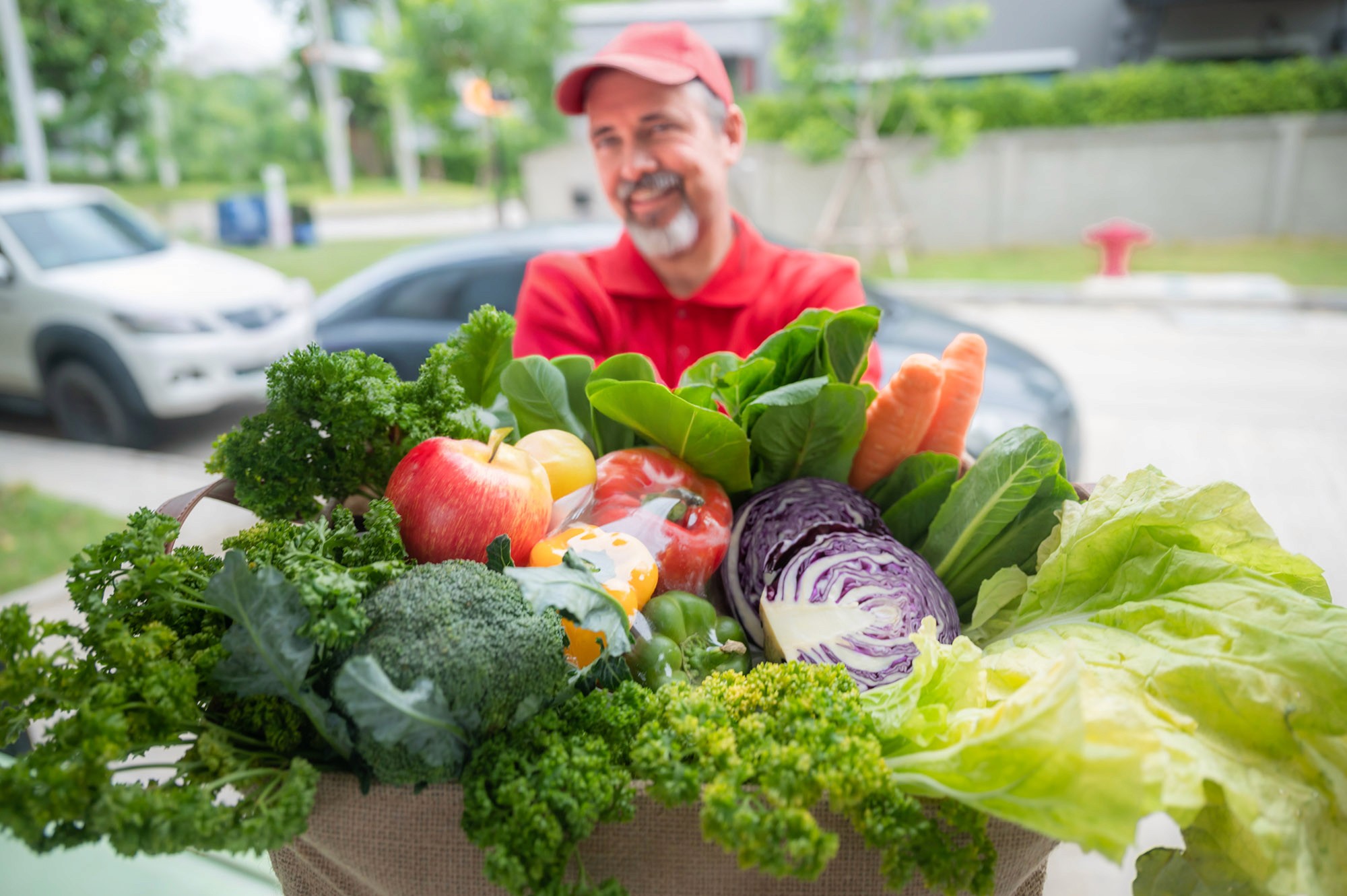 two people in a workspace working on their laptops 