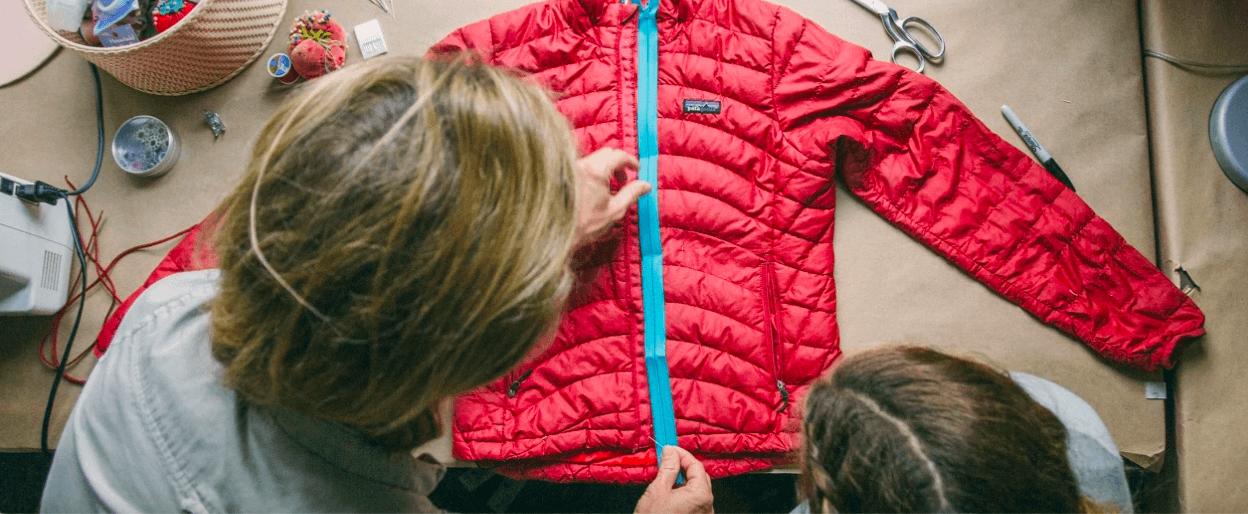 patagonia blog photo of two ladies measuring a jacket