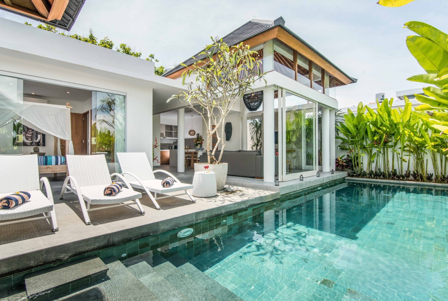 Modern Canggu villa with a private pool and sun loungers. Contact our real estate agent for exclusive Bali listings.