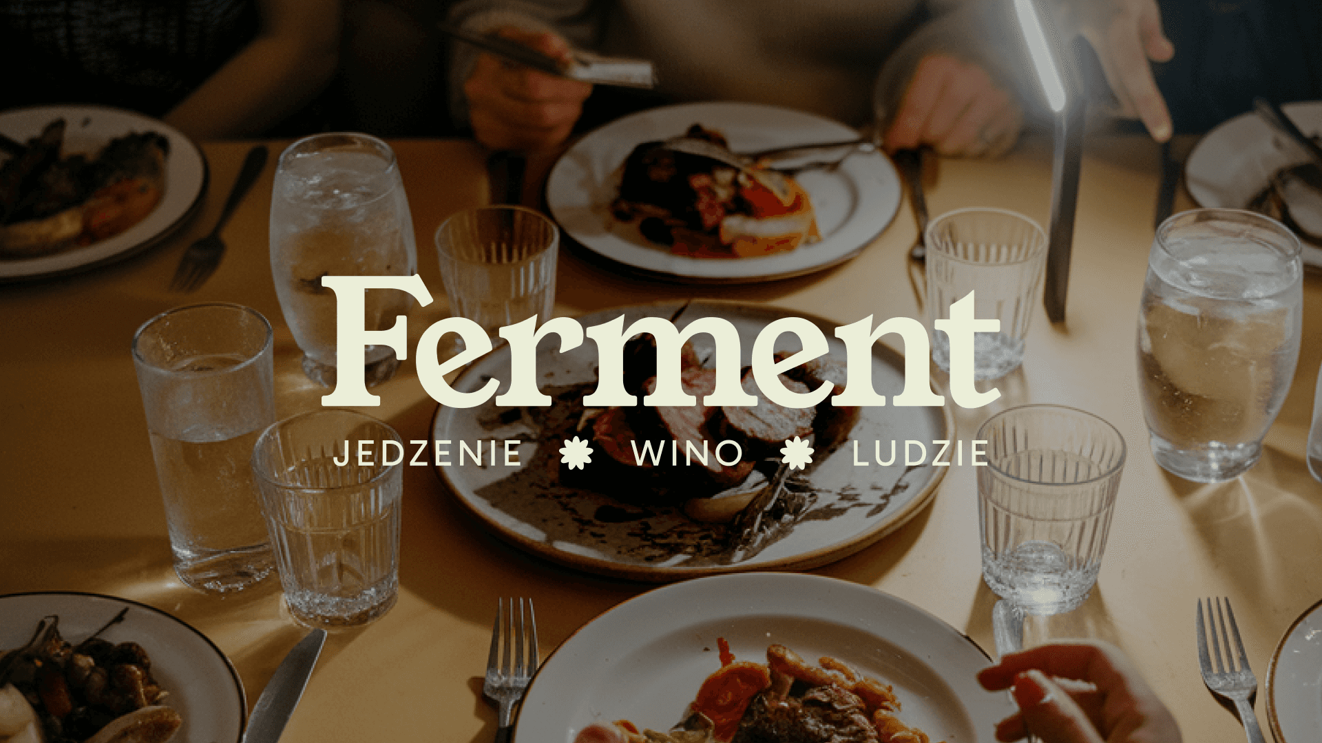 ferment logo on background photo showing table with food in restaurant