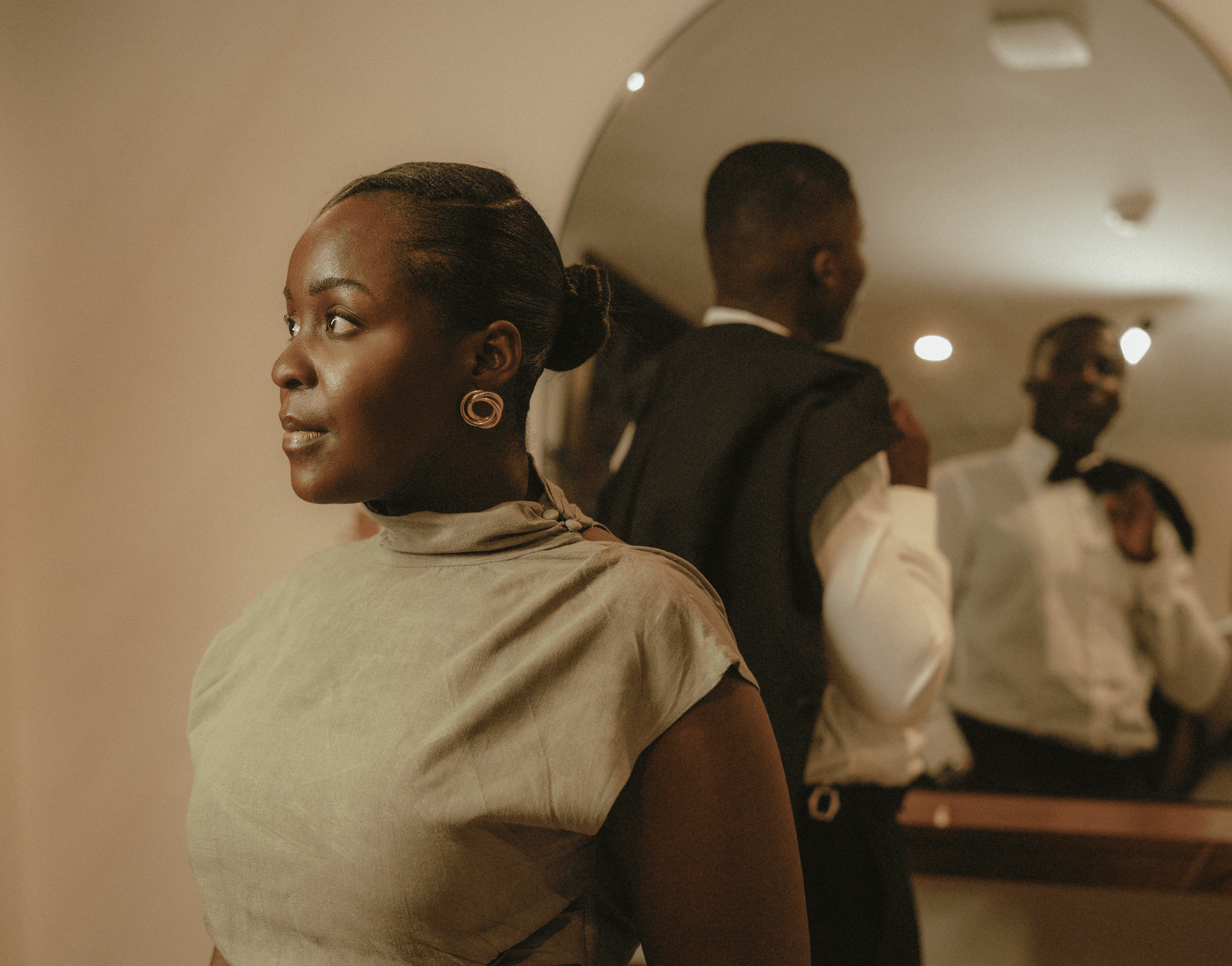 a couple holding hands while standing next to each other