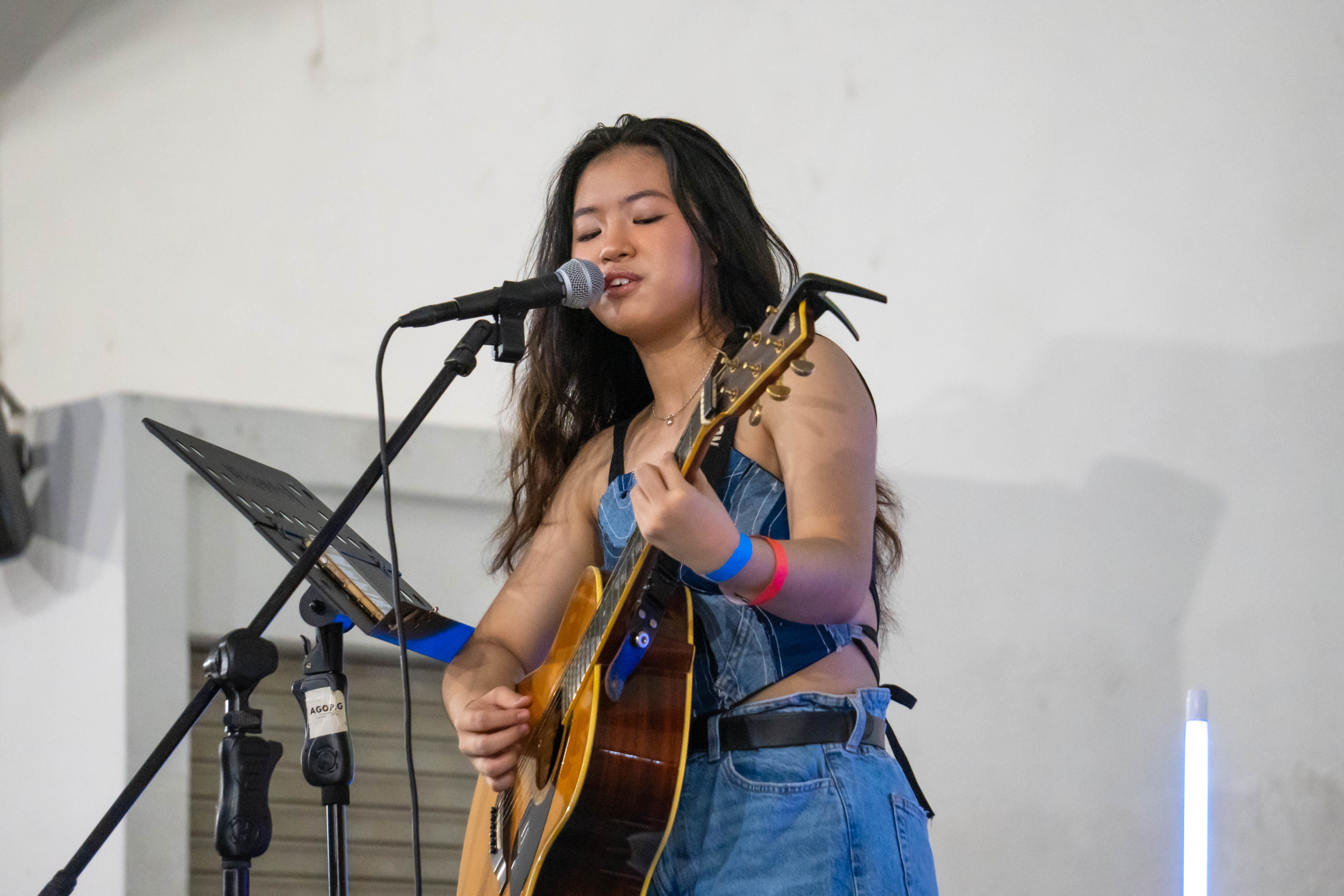 Lana Lajarca performing on stage for the Green Parade