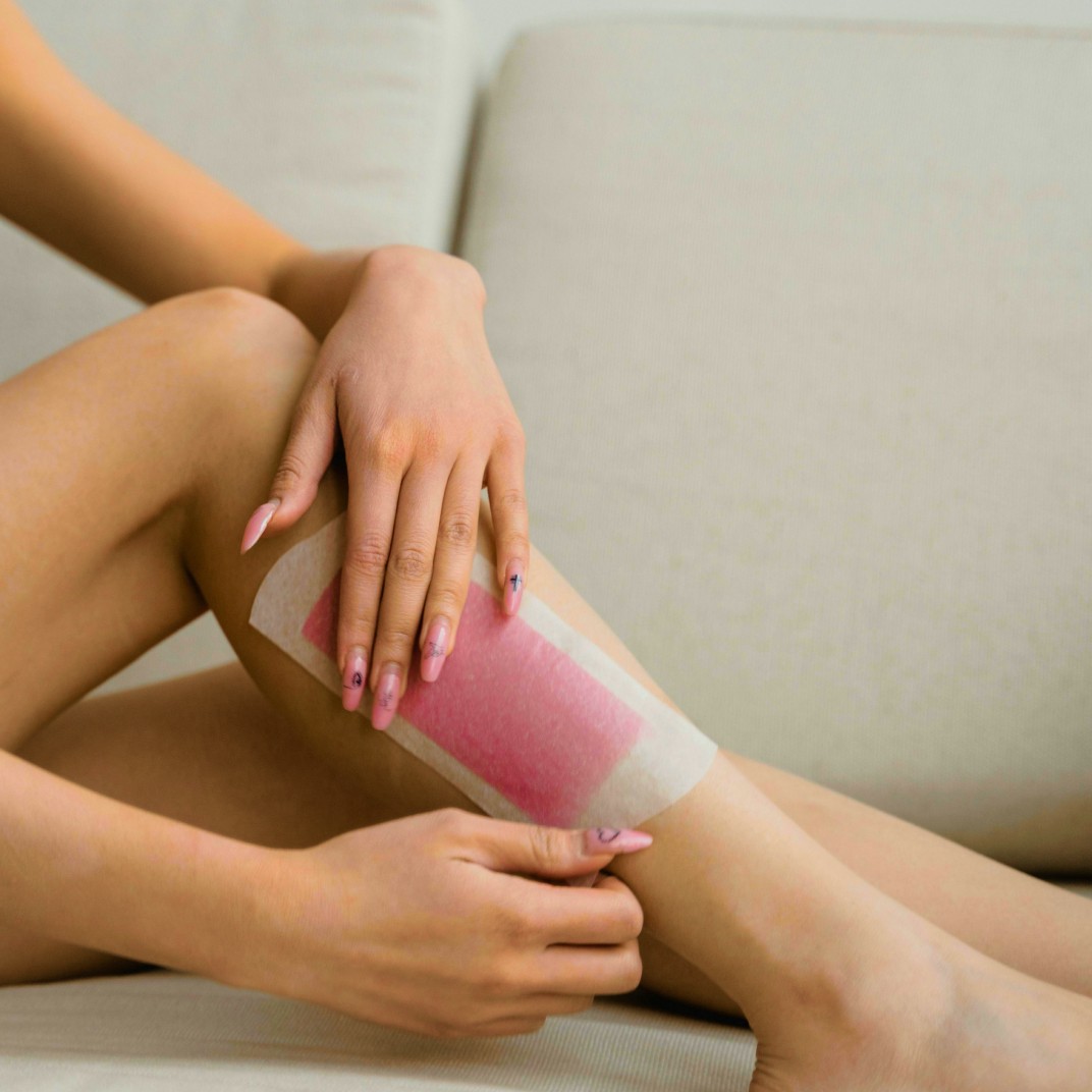 Woman getting her leg waxed