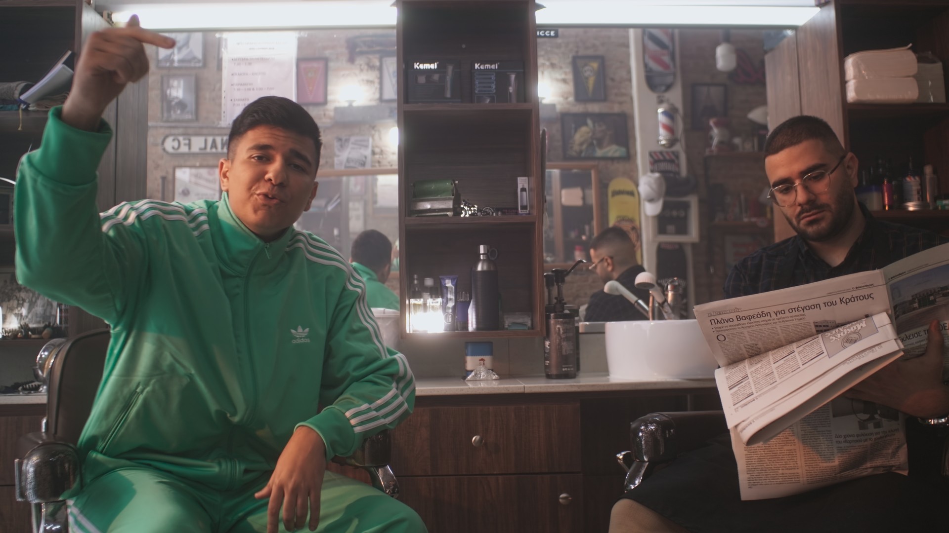 The singer raps in a barber shop in Larnaca, Cyprus during the shooting of his music videoclip