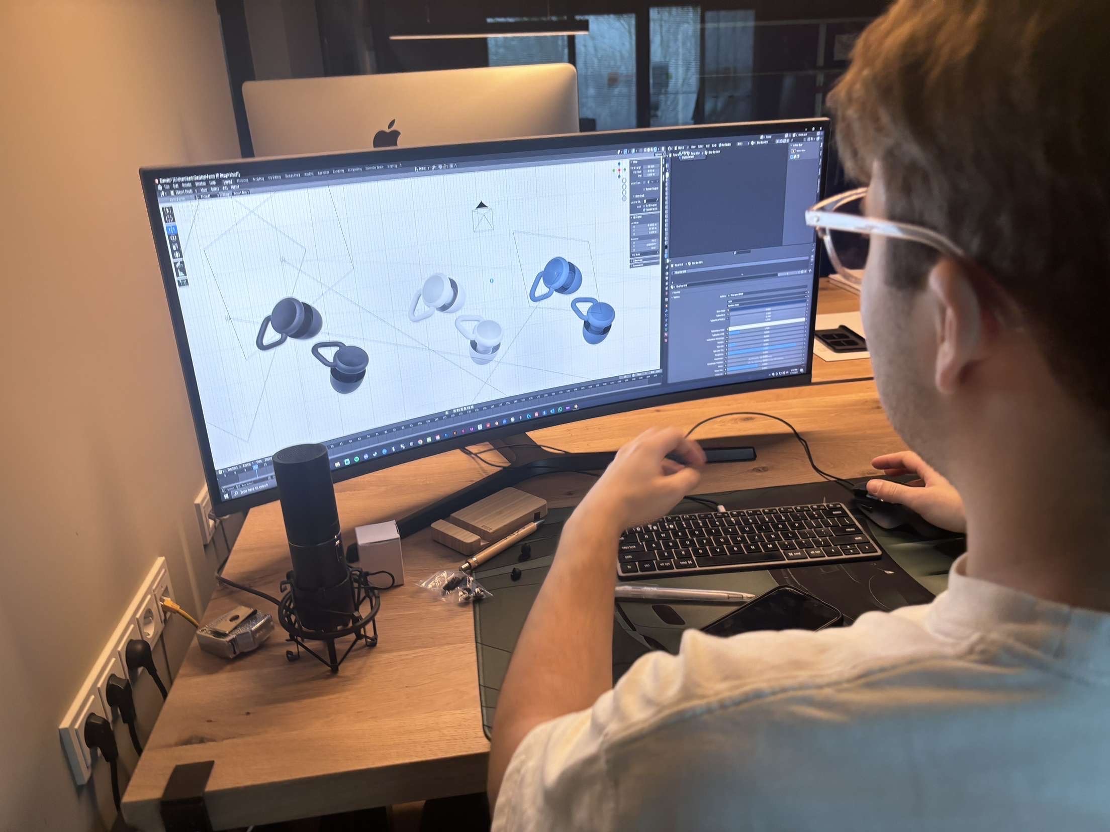 Black and white image of people working at a table with laptops, showing hands gesturing during discussion of digital content displayed on screens, with fabrica® logo in the corner.