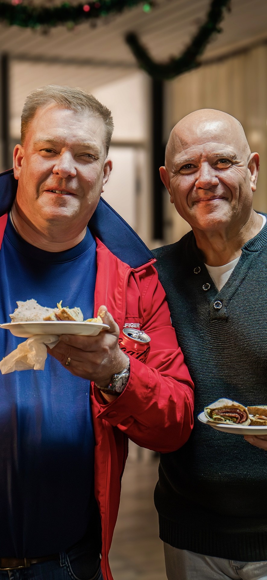 White building with red lighthouse under clear sky.