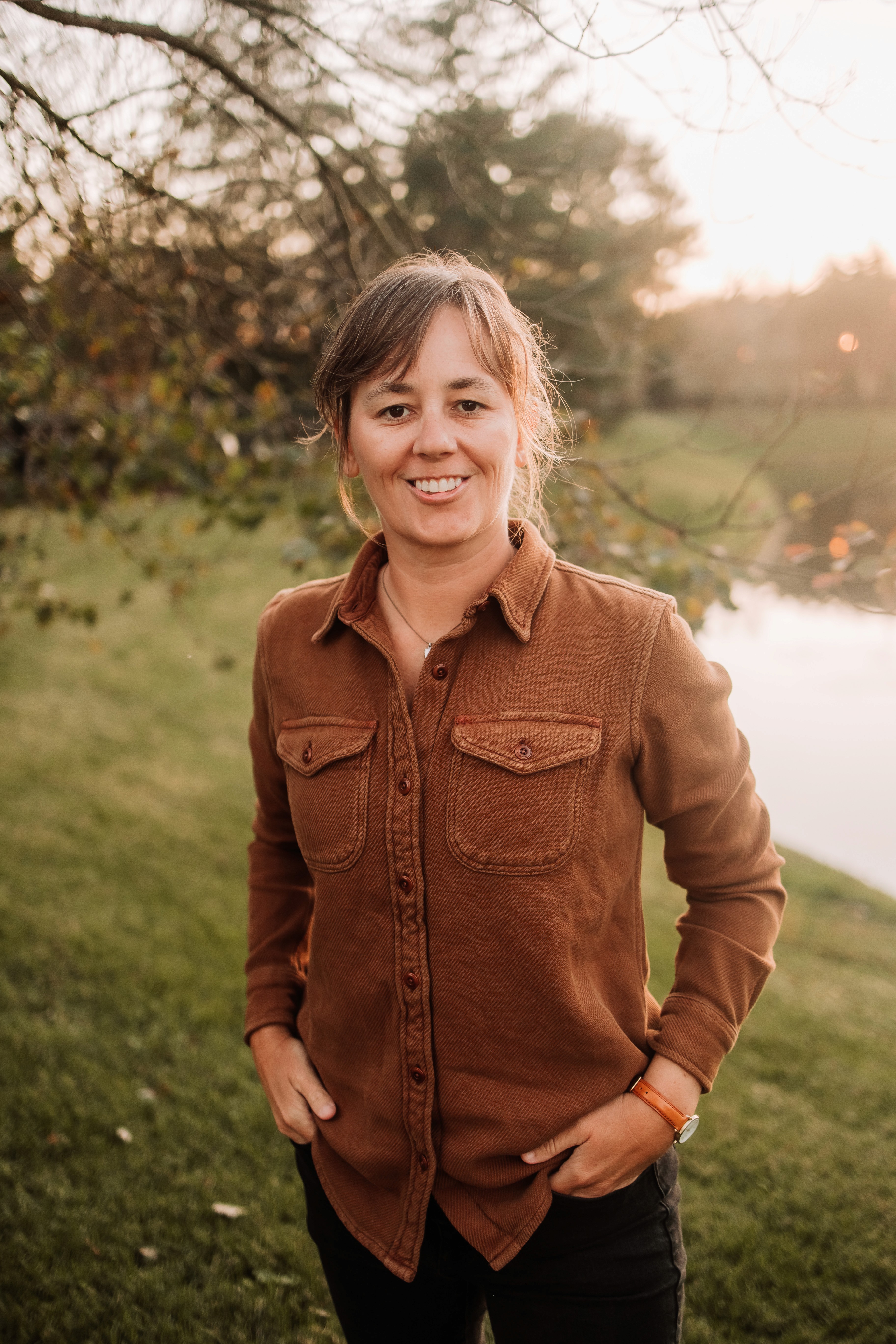 woman resting on stairs smiling at camera