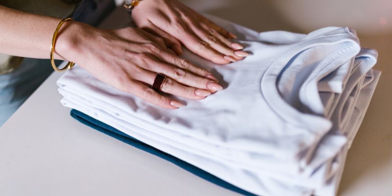 A Malaysian retail staff folding clothes