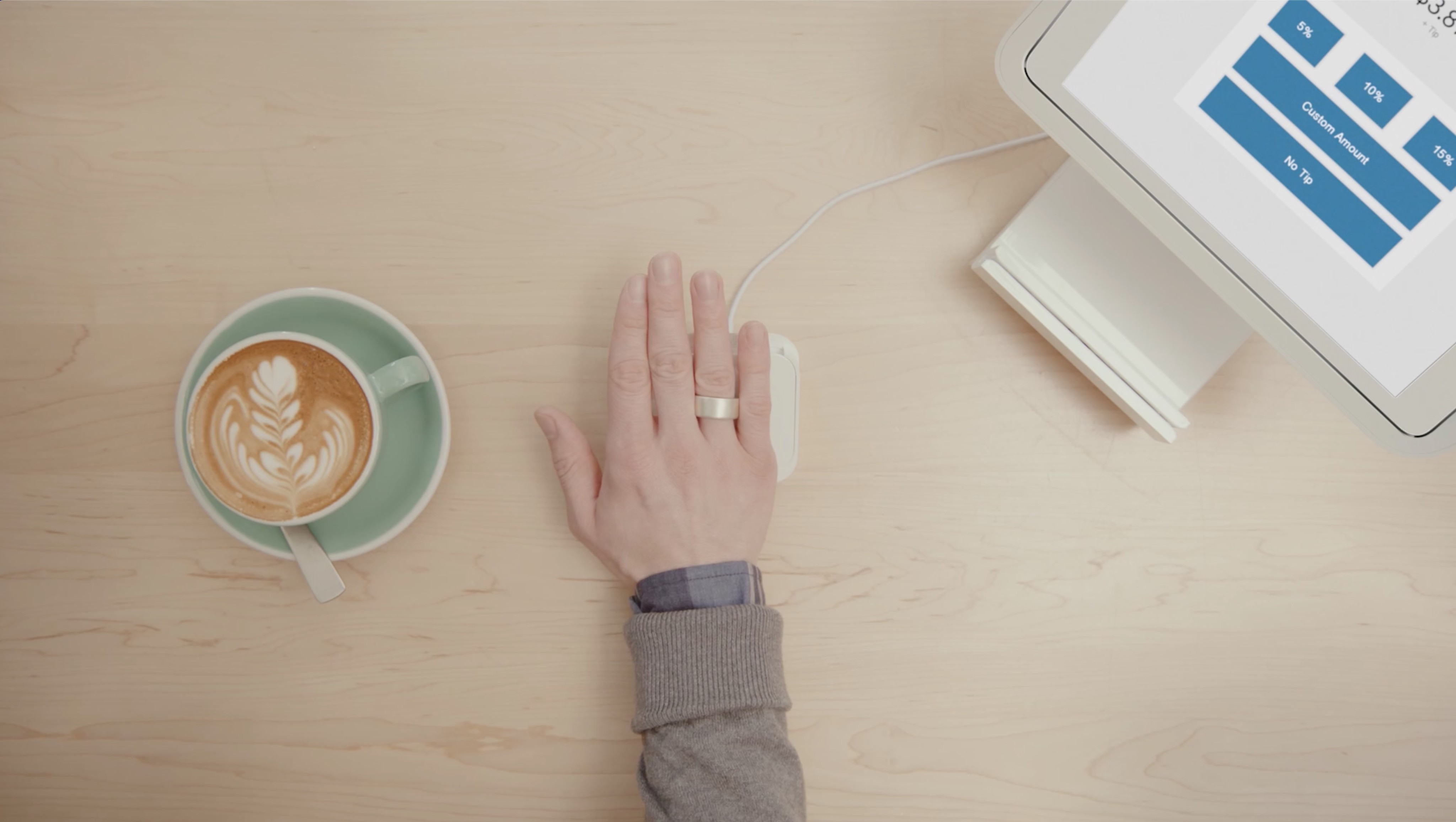 Someone using Token to pay for a coffee