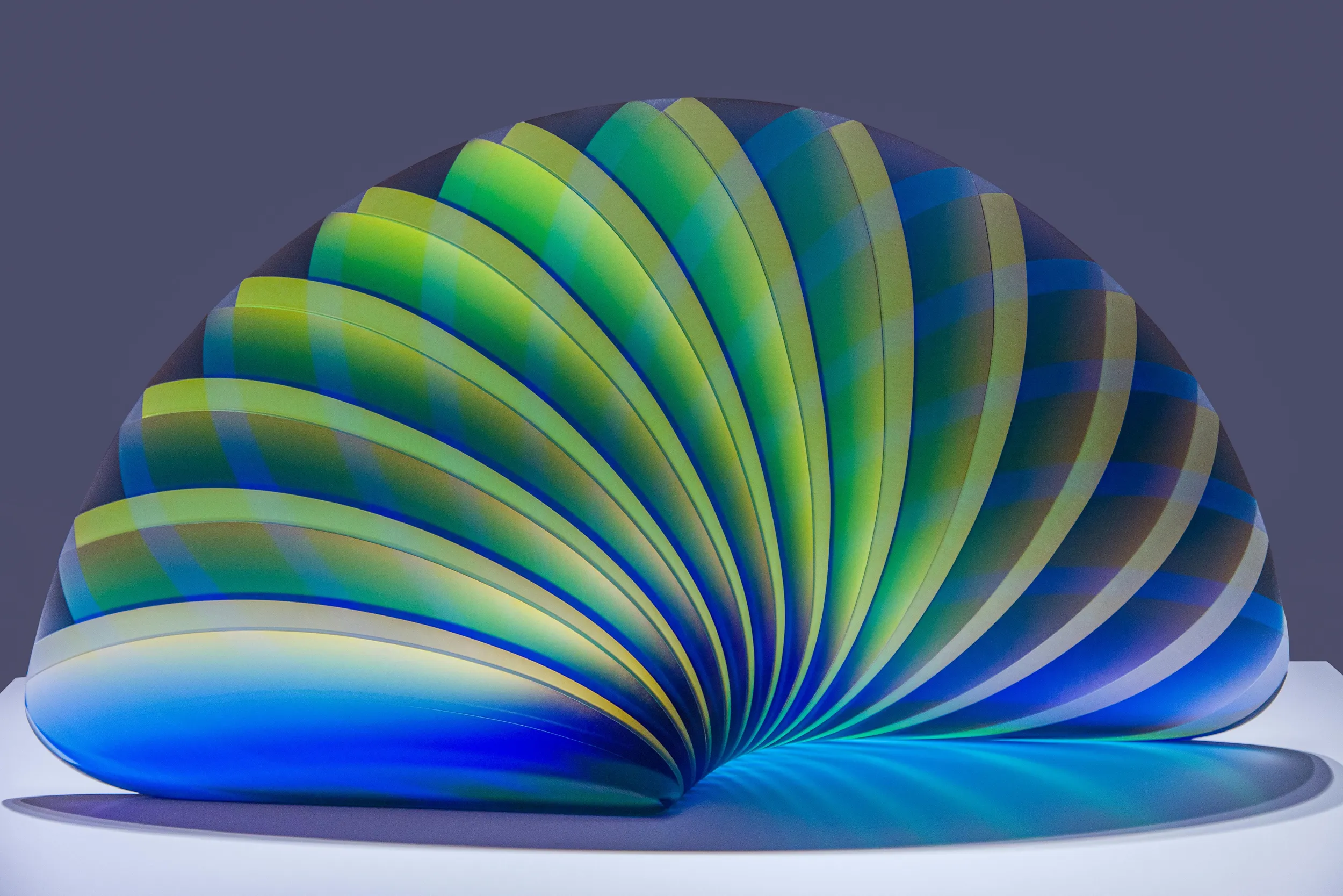 Abstract 3D shell-shaped form with layered green and blue gradients, generative design artwork