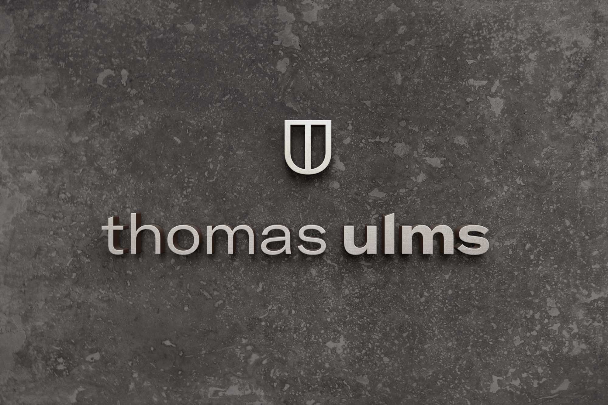 Thomas Ulms Corporate Design Wand Logo