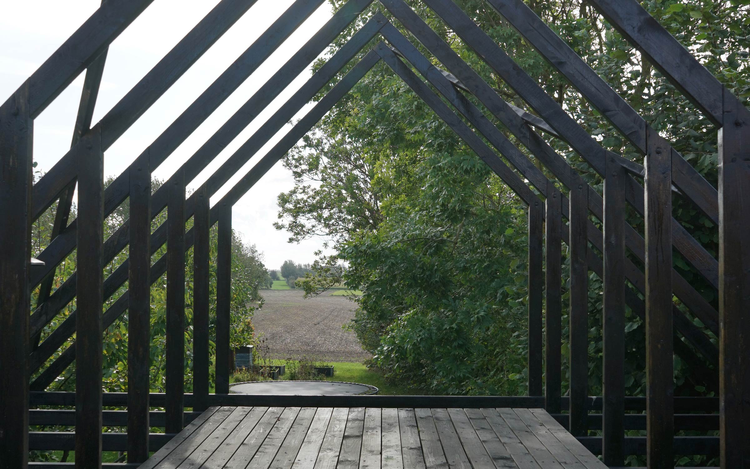 Bakkely Sauna and Guest House timber roof structure and terrace on Ærø designed by architect Asger Risborg Jakobsen