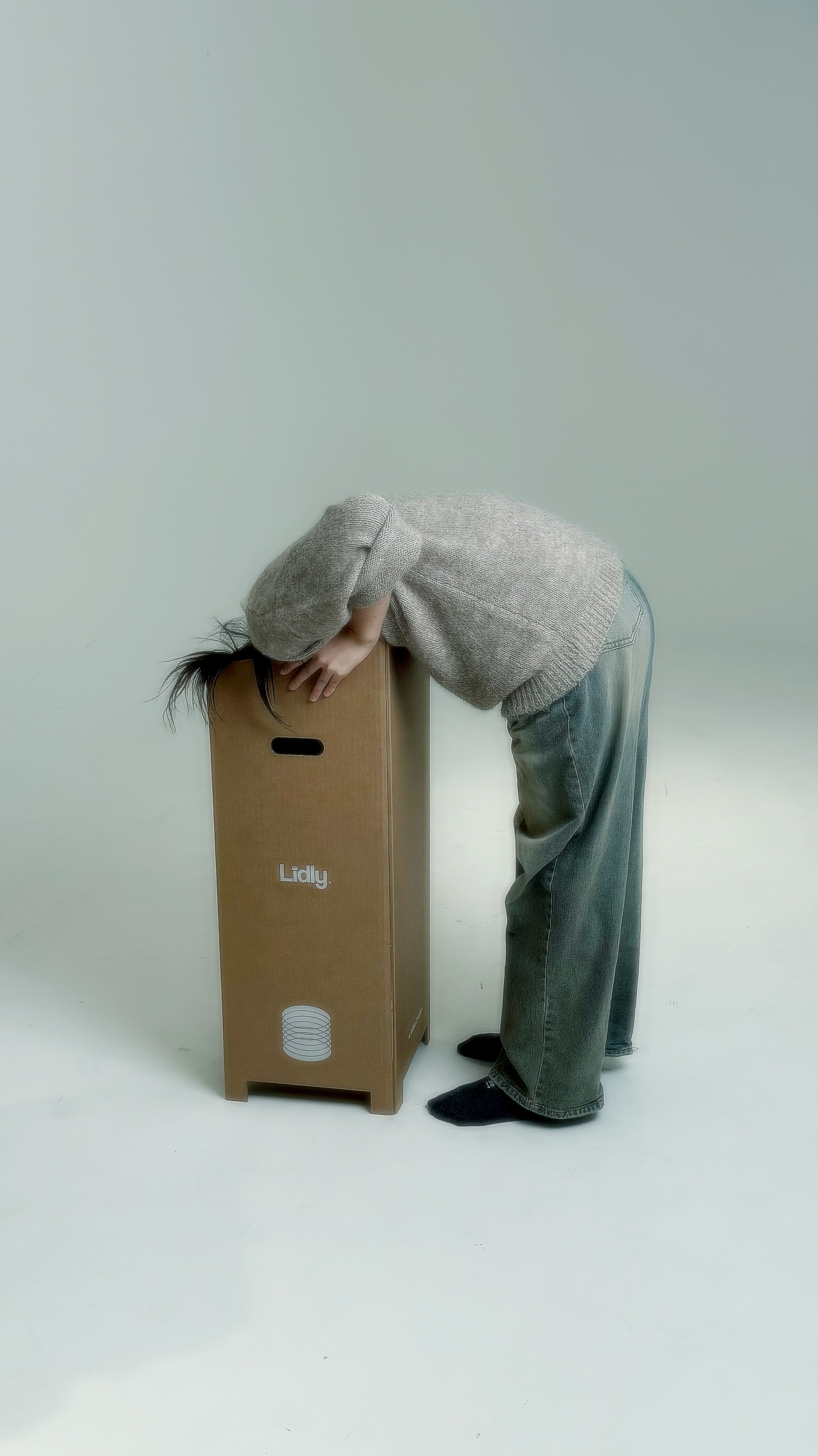 Freshly baked Margherita pizza with melted cheese, tomato sauce, and basil leaves, held by a person’s hand.