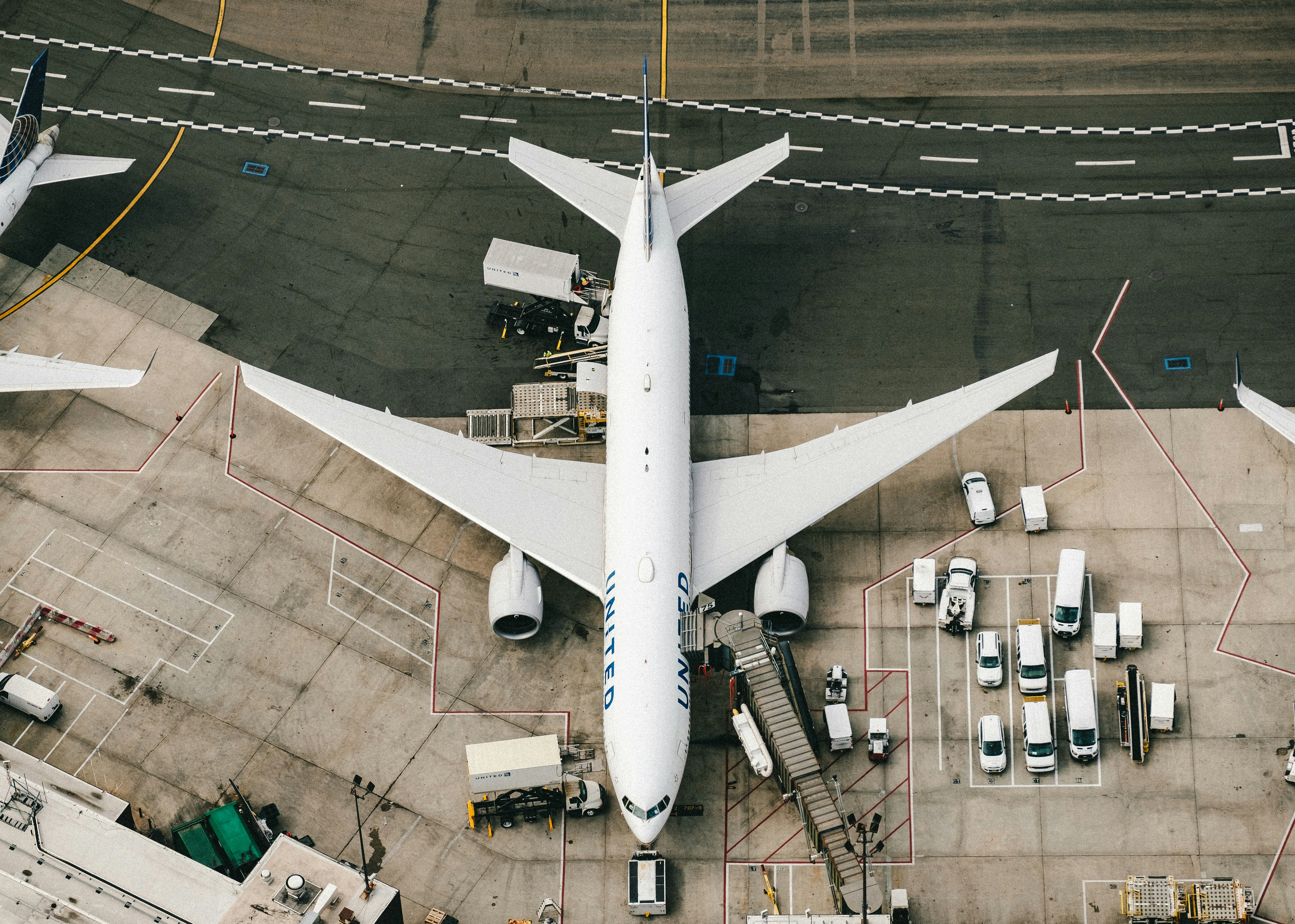 A large jetliner sitting on top of an airport tarmac