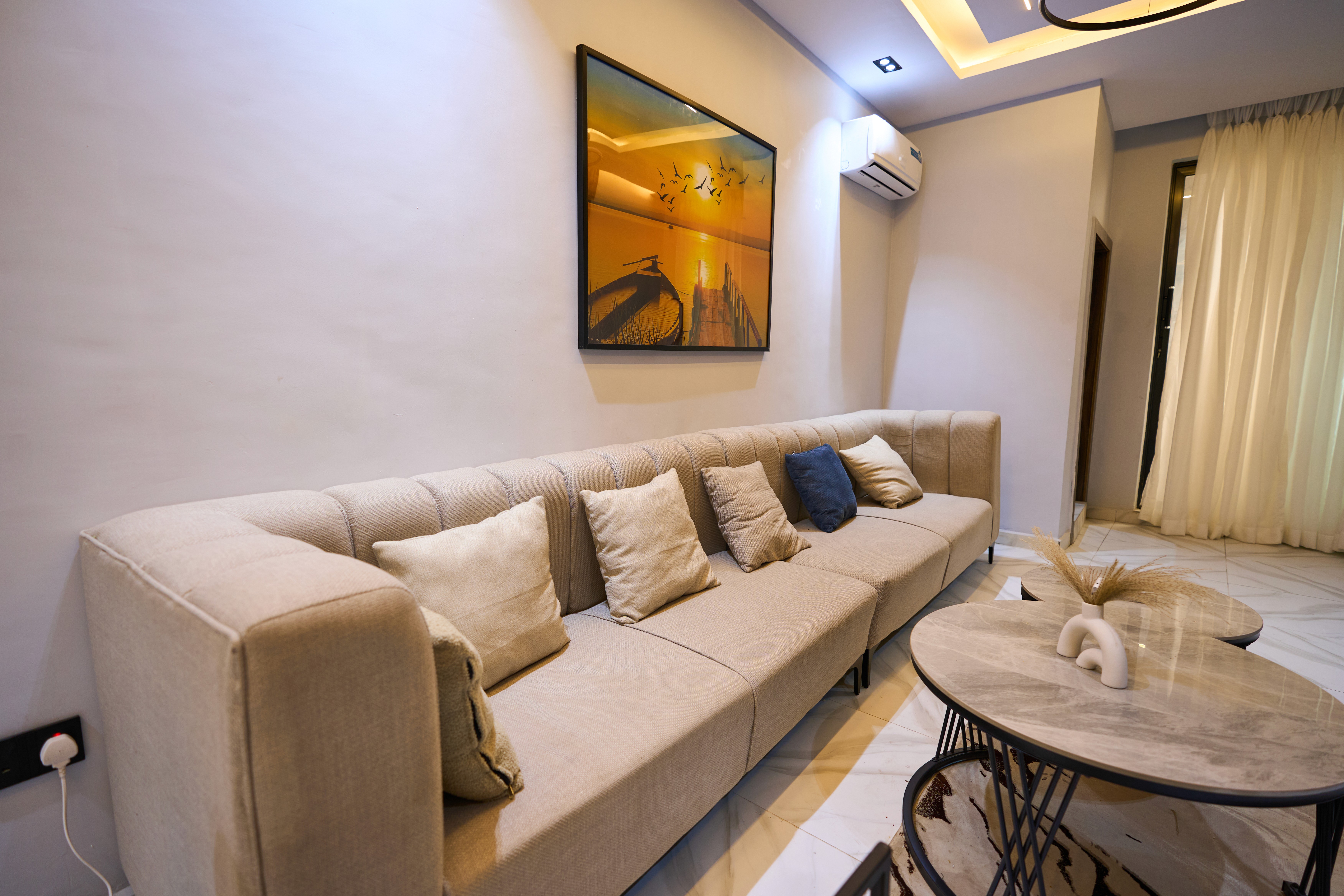 Bright living room interior of a Lodge & Loft serviced apartment in Lagos