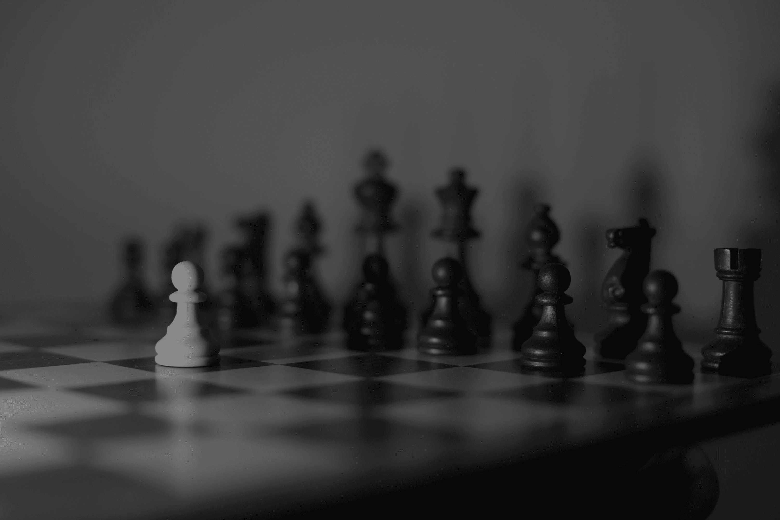 a black and white photo of a chess board