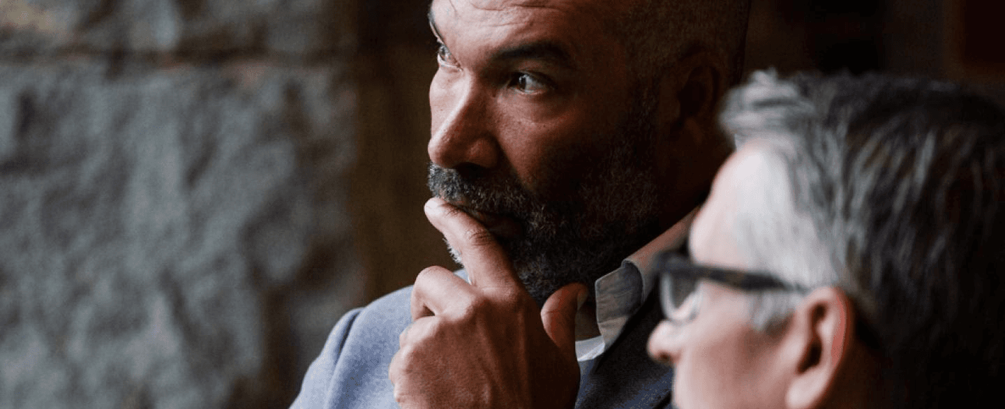 Two retirement plan advisors in discussion at RPAI, reflecting candid dialogue and real-world perspectives shaped by plan advisors.