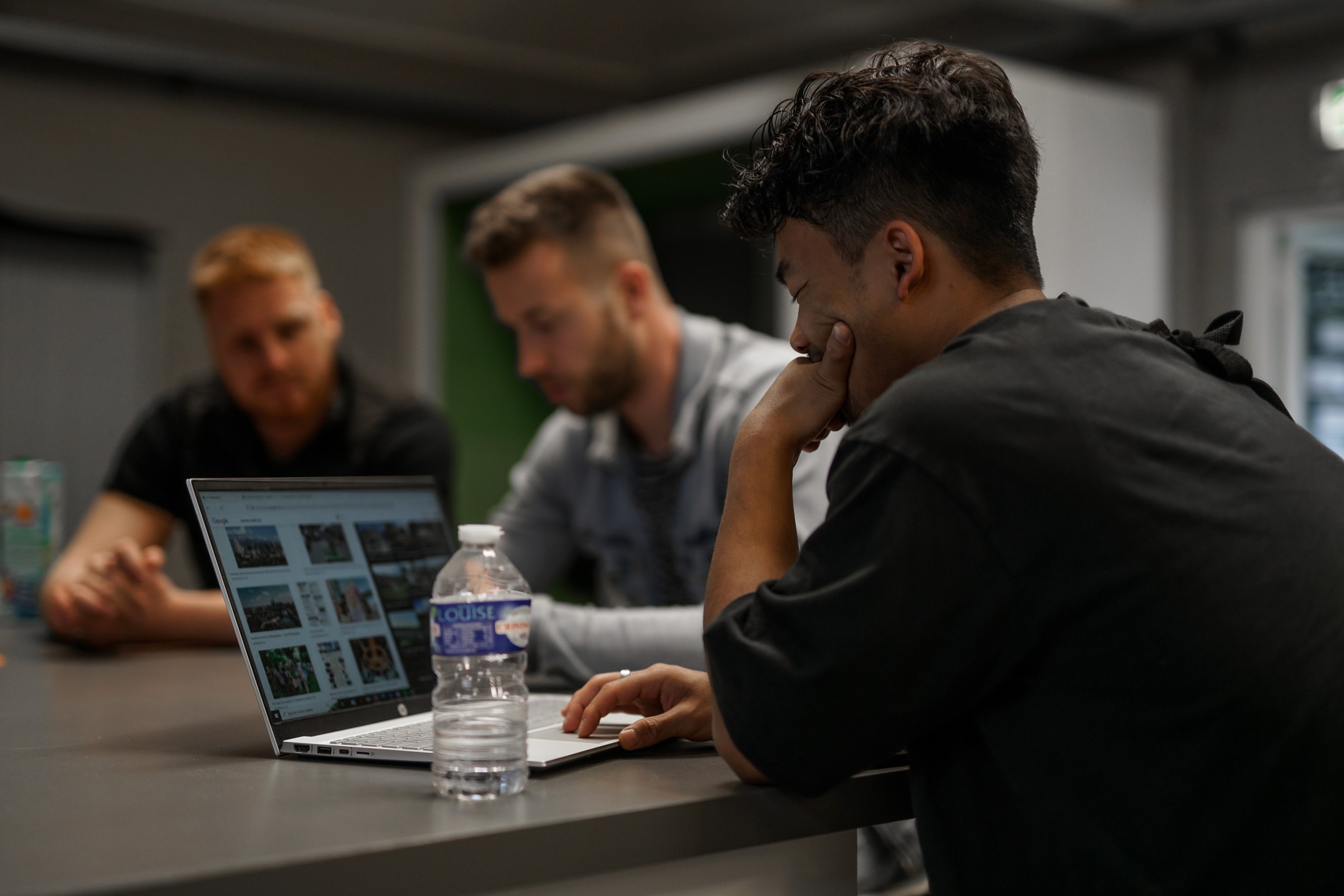 A man standing with Sufboard