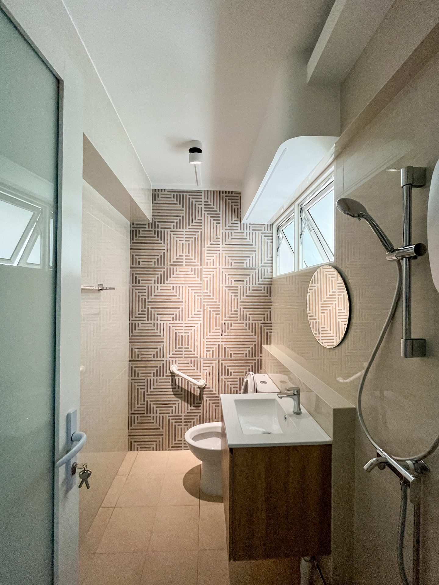 Geometric pattern tiles from Hafary for acccent wall in bathroom 
