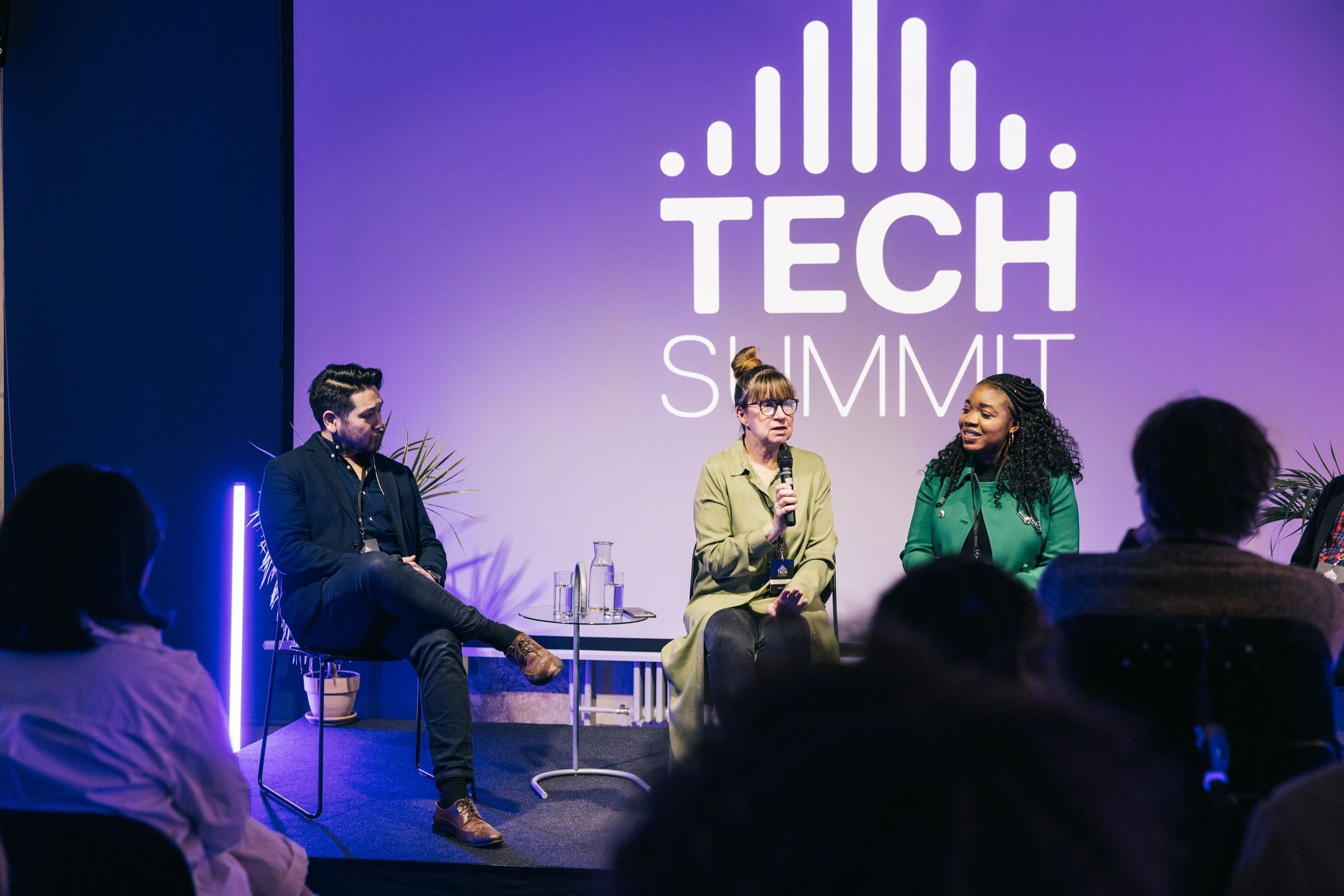 a black and white living room with a large tv