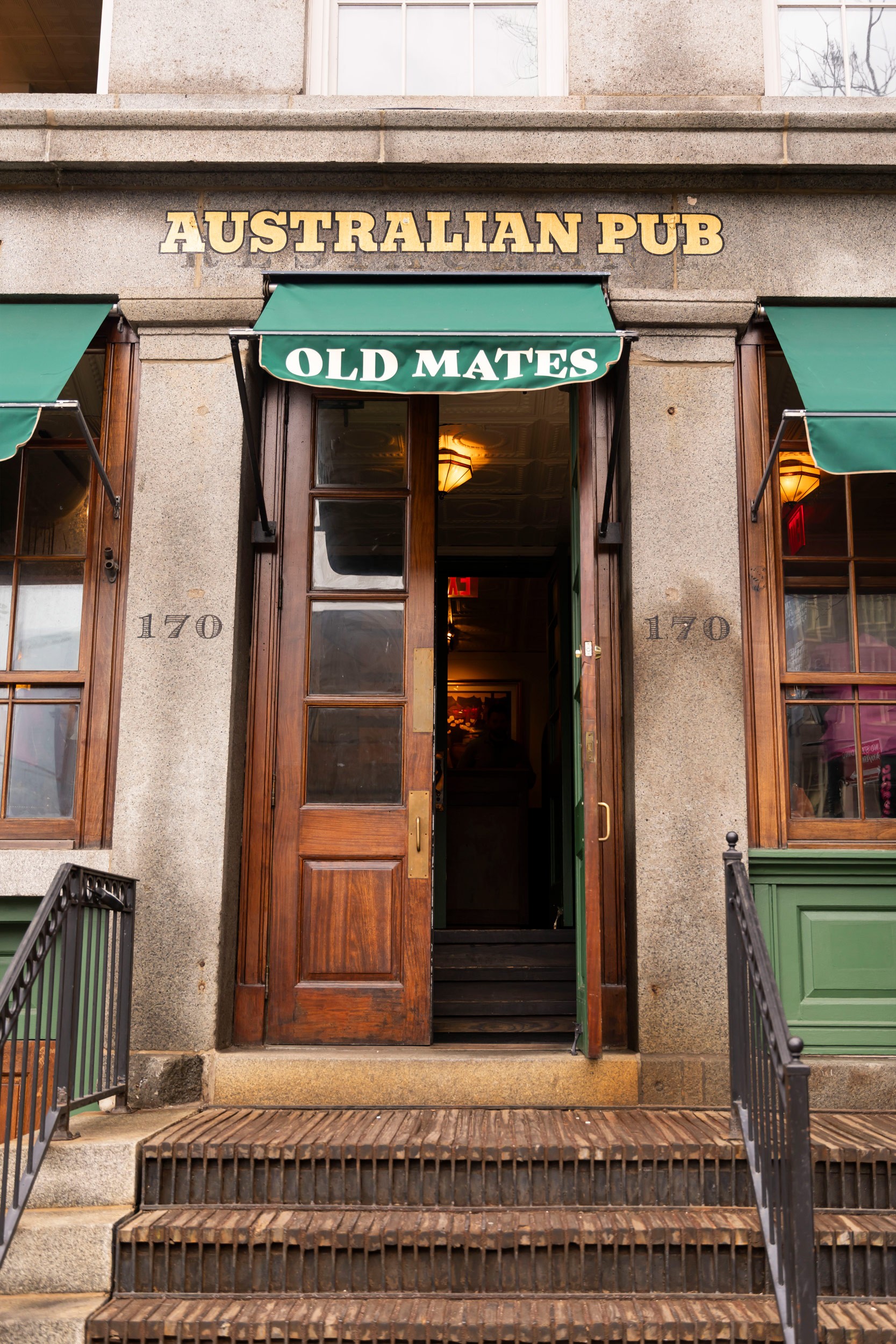 Old Mates Australian pub branding, interior signage and collateral at the Seaport location.