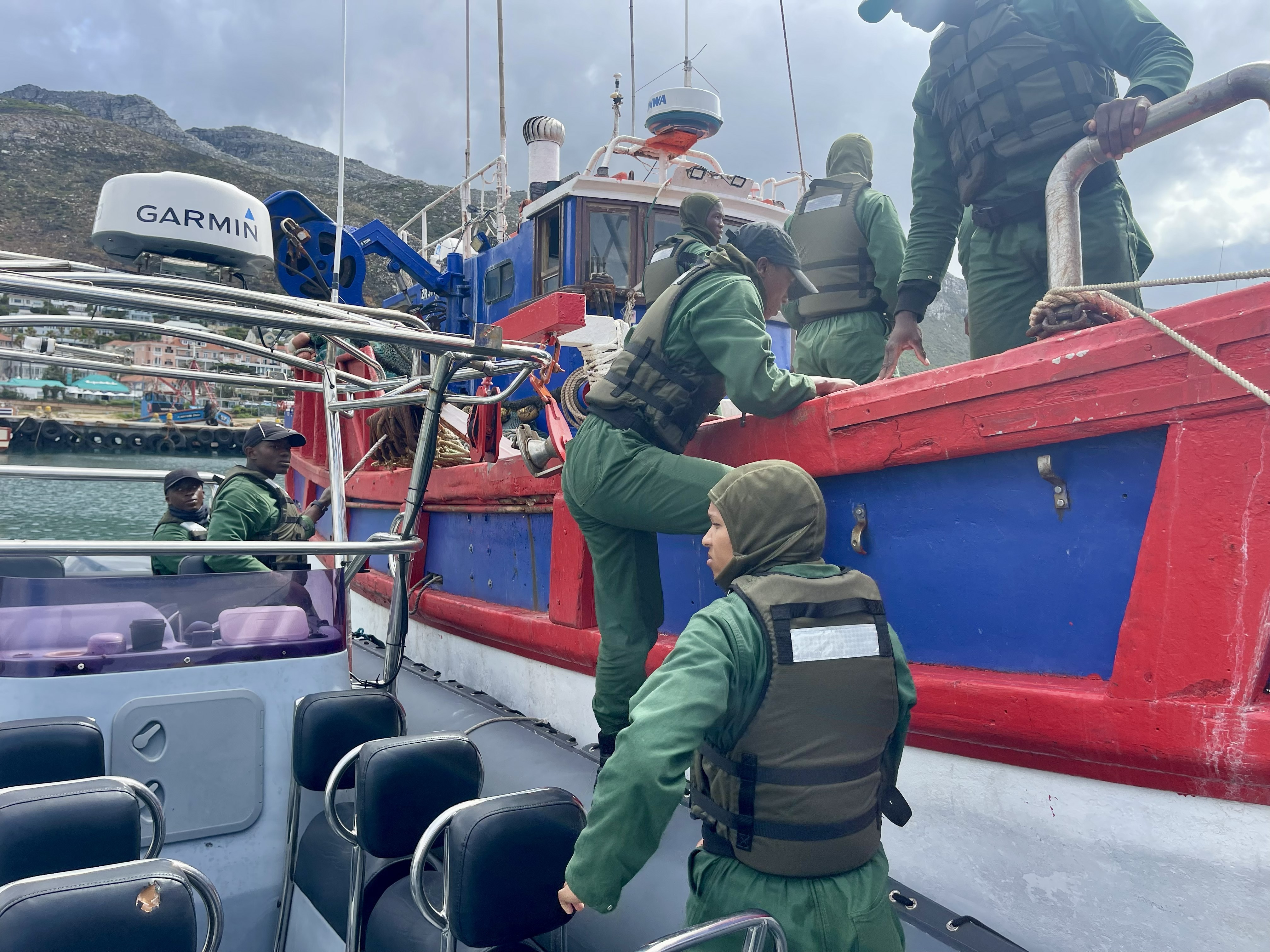 Marine personnel boarding a patrol vessel