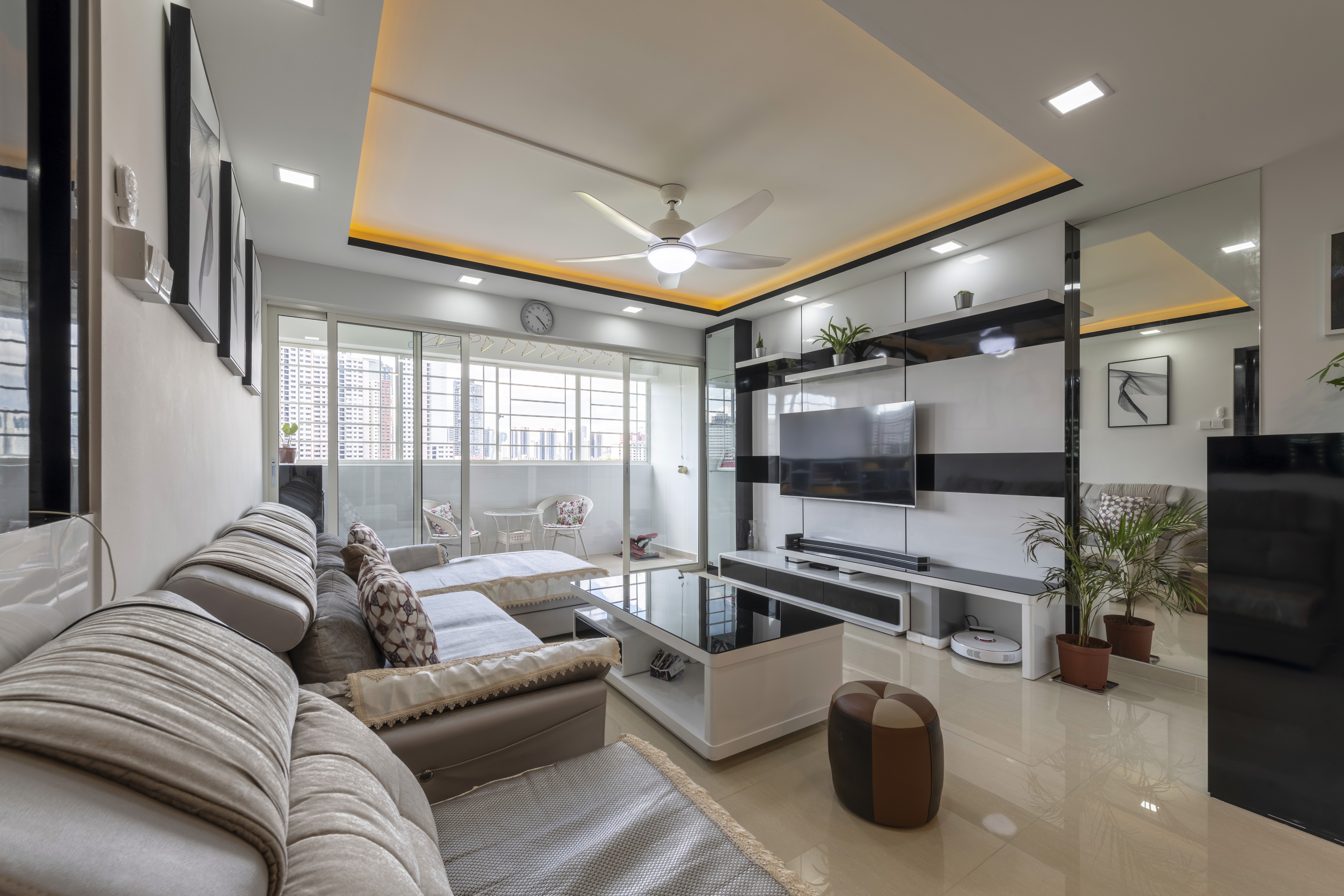 Living area with warm tones, wood paneling, and ambient lighting.