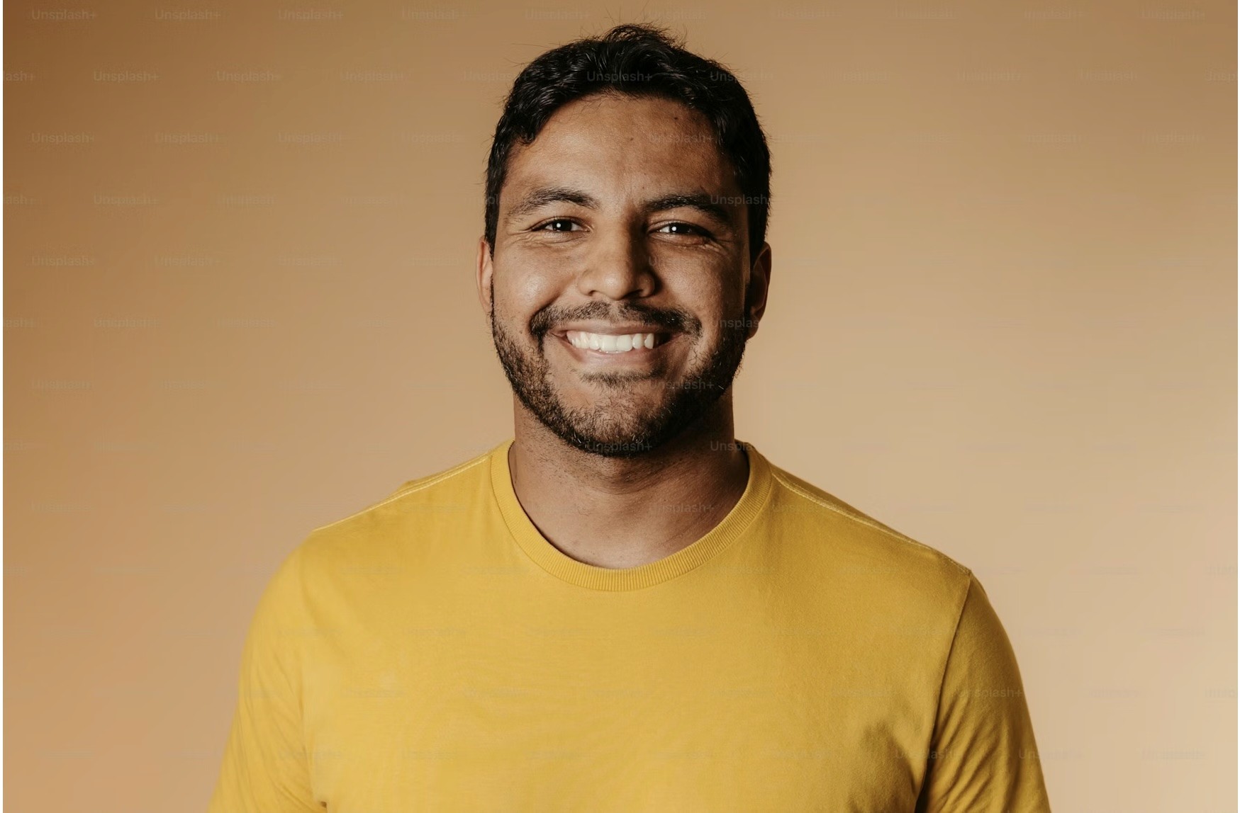 three people sitting in front of table laughing together