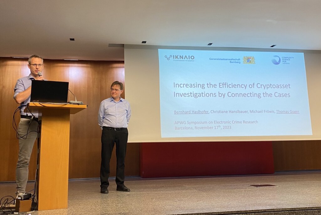 Researchers presenting findings on improving cryptoasset investigations at APWG Symposium 2024 in Barcelona, highlighting case connections and solutions for cybercrime.