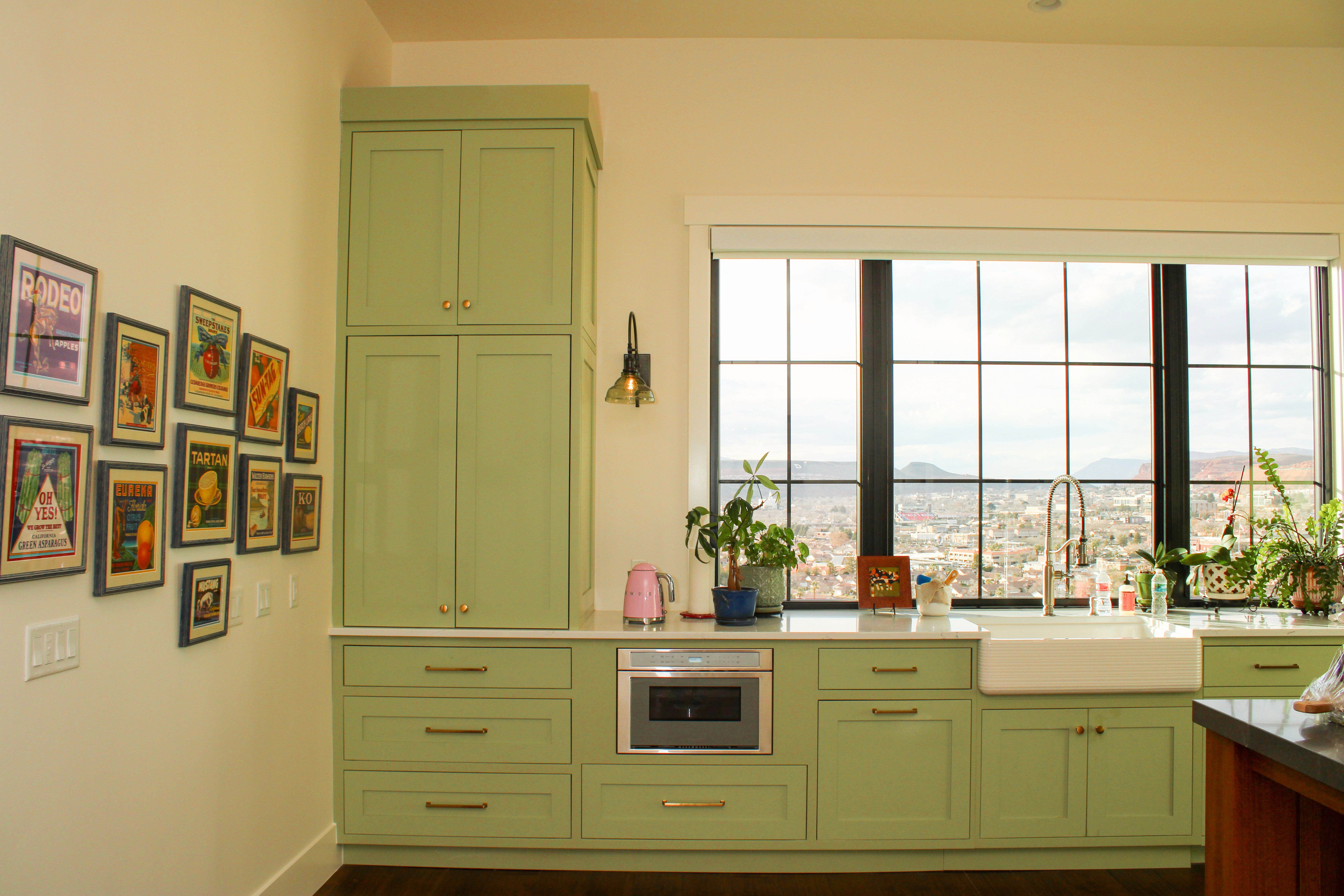 Kitchen remodel in St. George Utah featuring a wood island, green cabinets, and functional layout for everyday life